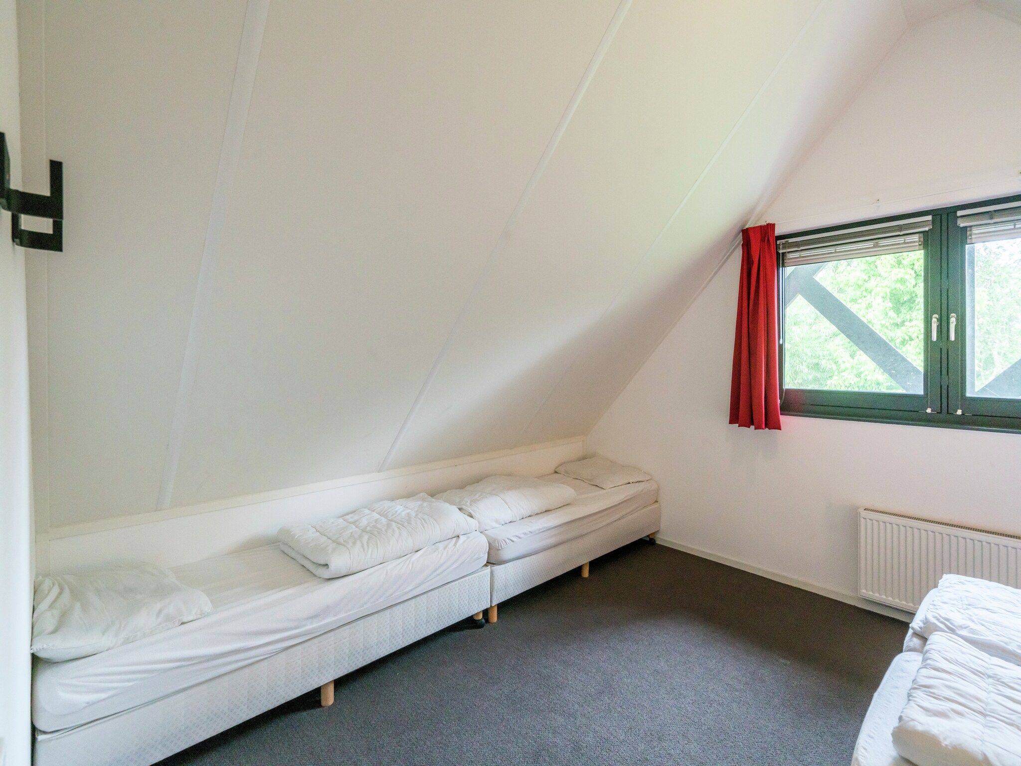 Een slaapkamer van Huize Lewis in Balk