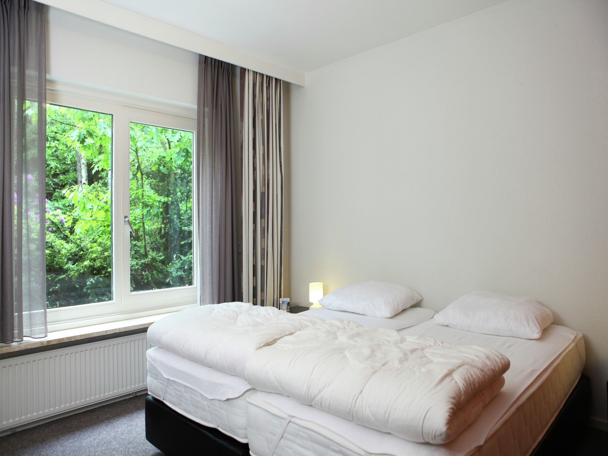 Een slaapkamer van De grove den in Doornspijk