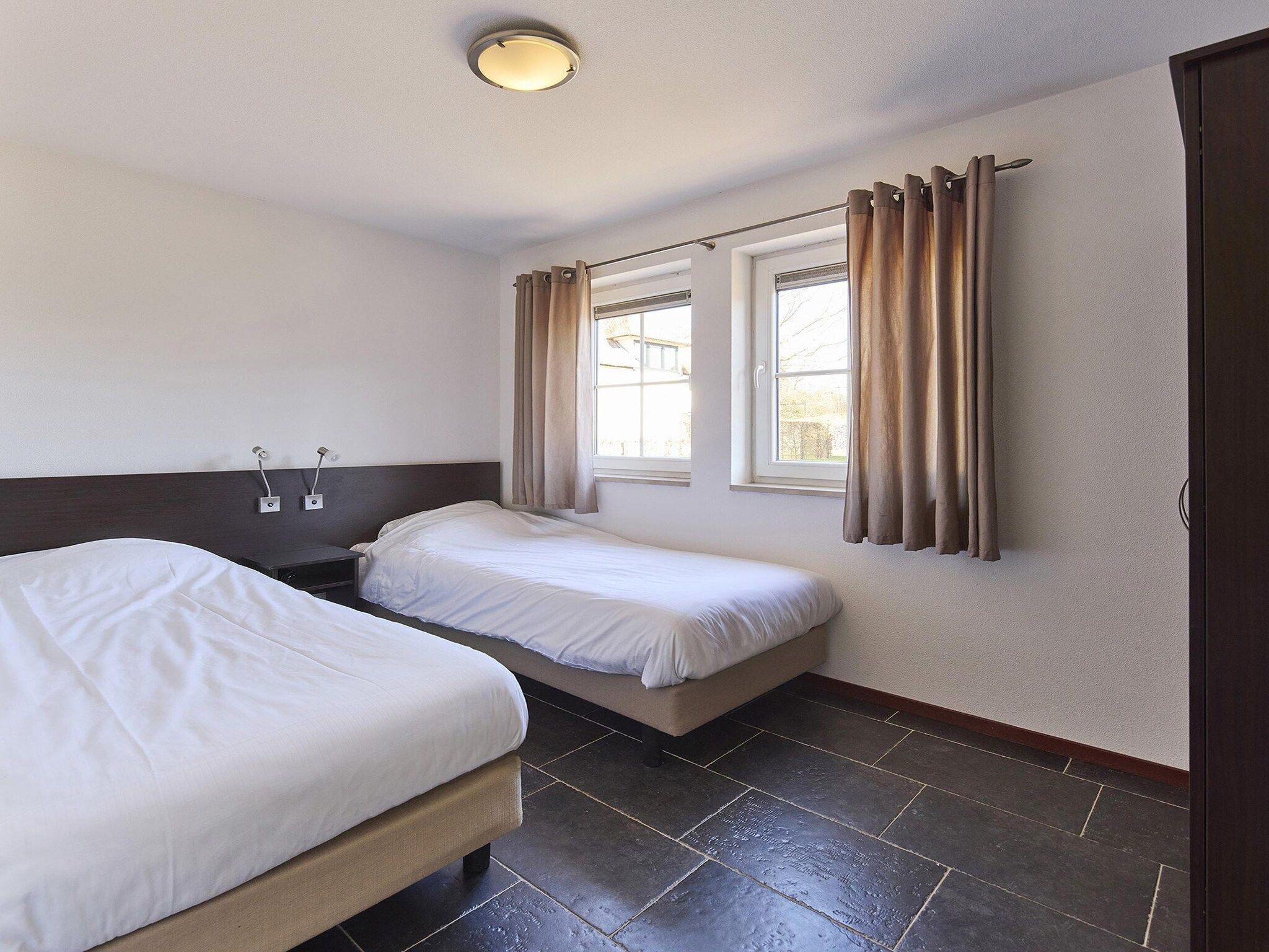 Een slaapkamer van Buitenhof De Leistert 7 in Roggel