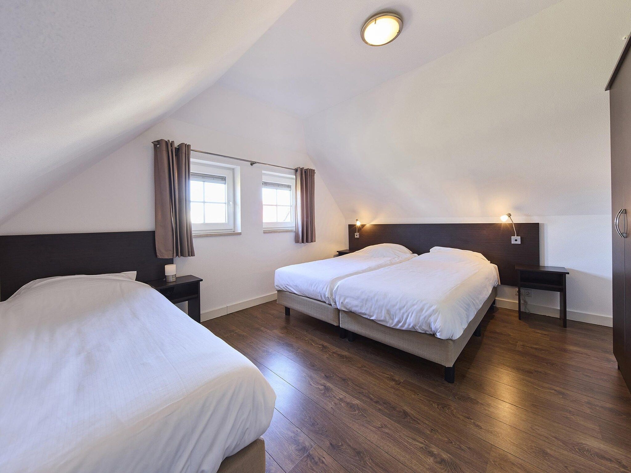 Een slaapkamer van Buitenhof De Leistert 7 in Roggel