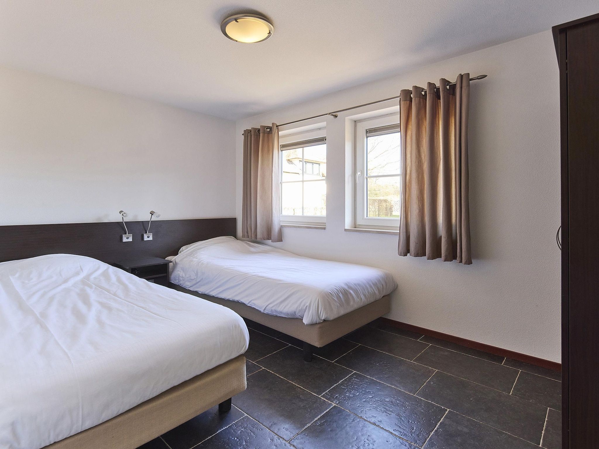 Een slaapkamer van Buitenhof De Leistert 5 in Roggel