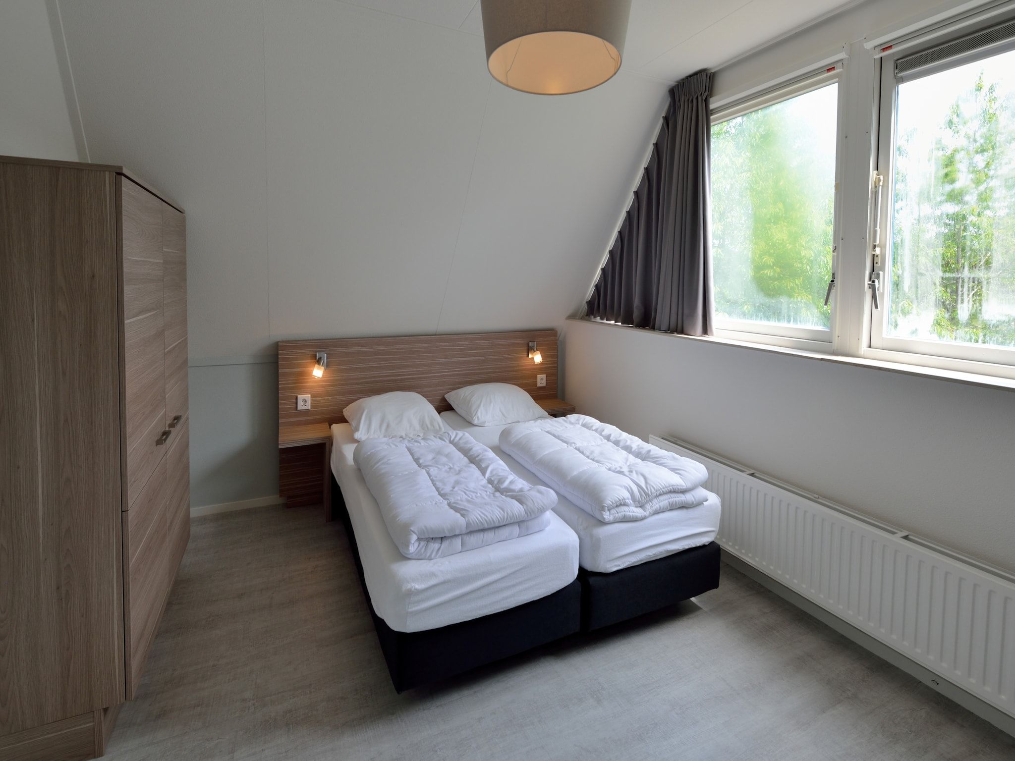 Een slaapkamer van Villapark Schildmeer 4 in Steendam