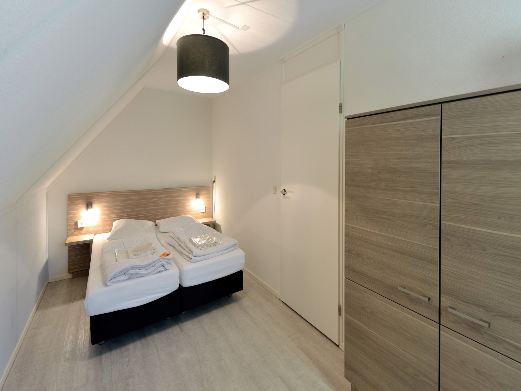 Een slaapkamer van Villapark Schildmeer 3 in Steendam