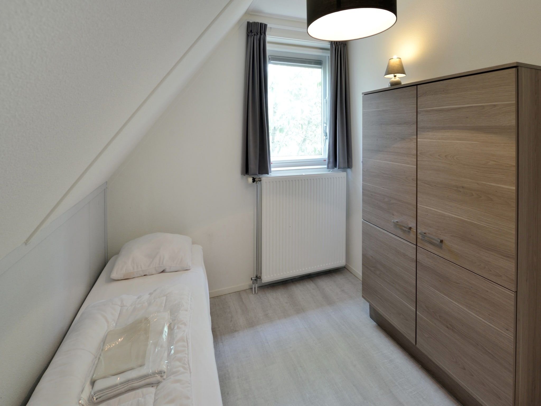 Een slaapkamer van Villapark Schildmeer 3 in Steendam