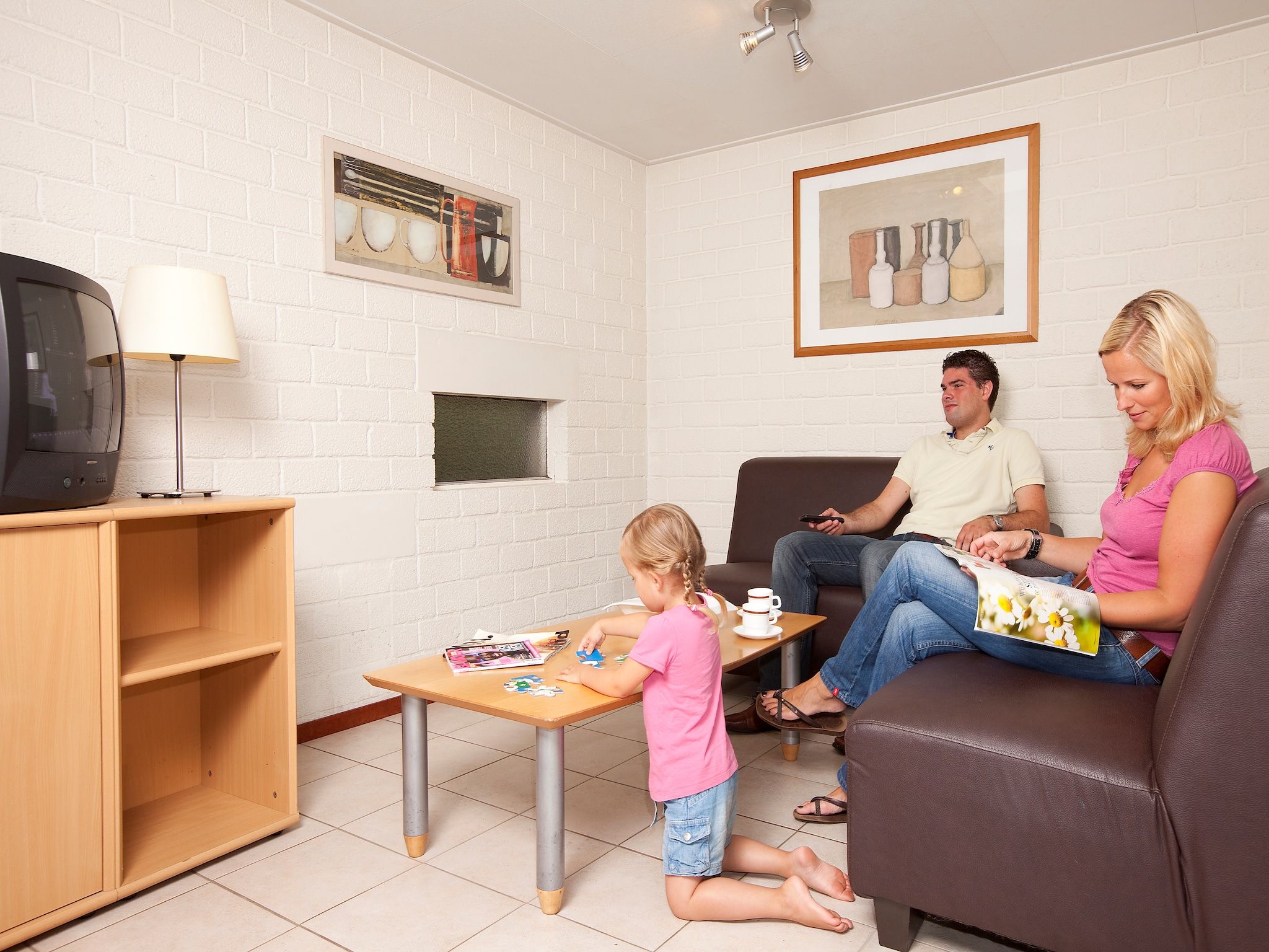 De woonkamer van Vakantiepark de Berkenhorst 4 in Kootwijk