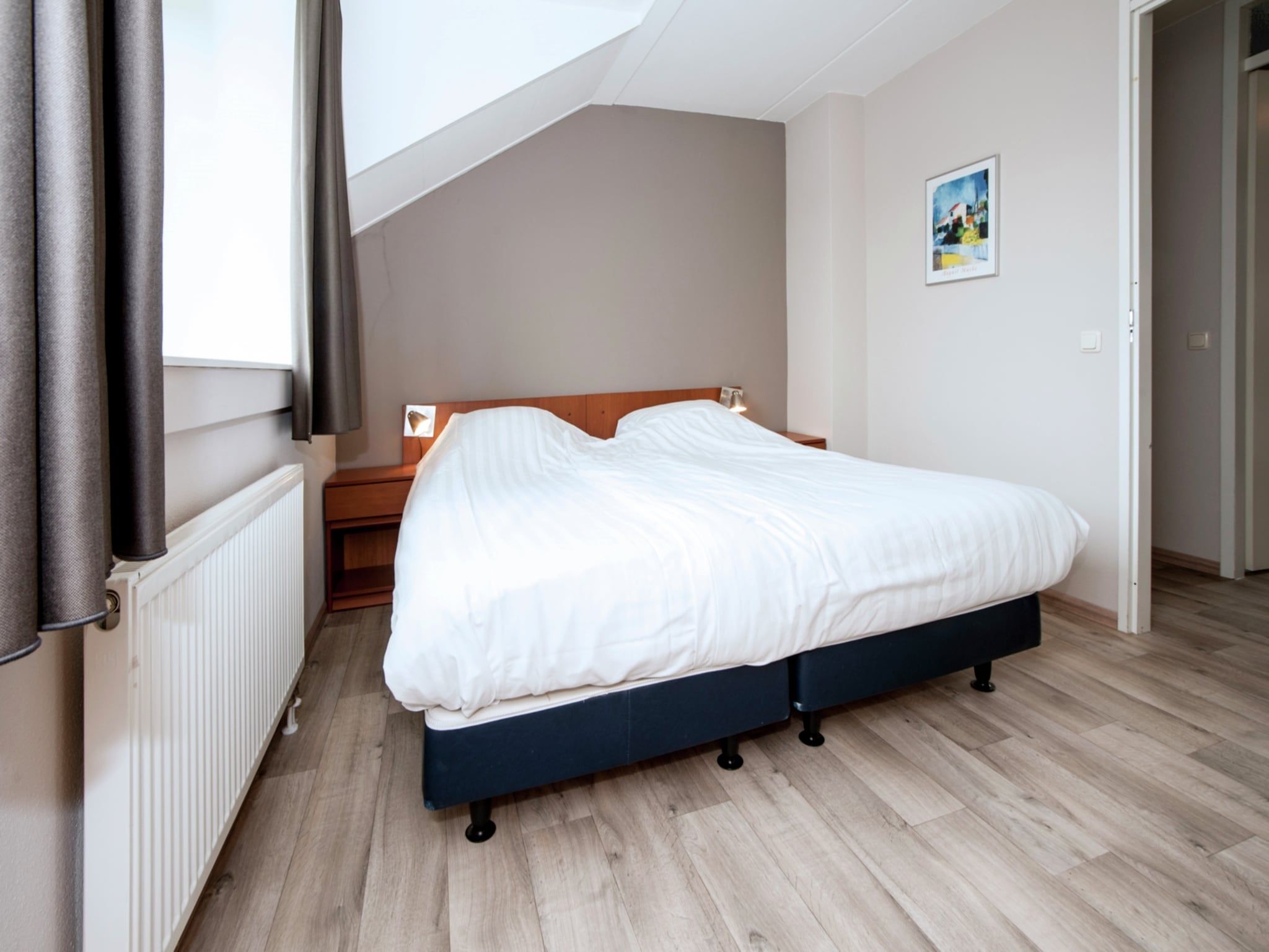 Een slaapkamer van Havenwoning 2-6 persoons in Heel