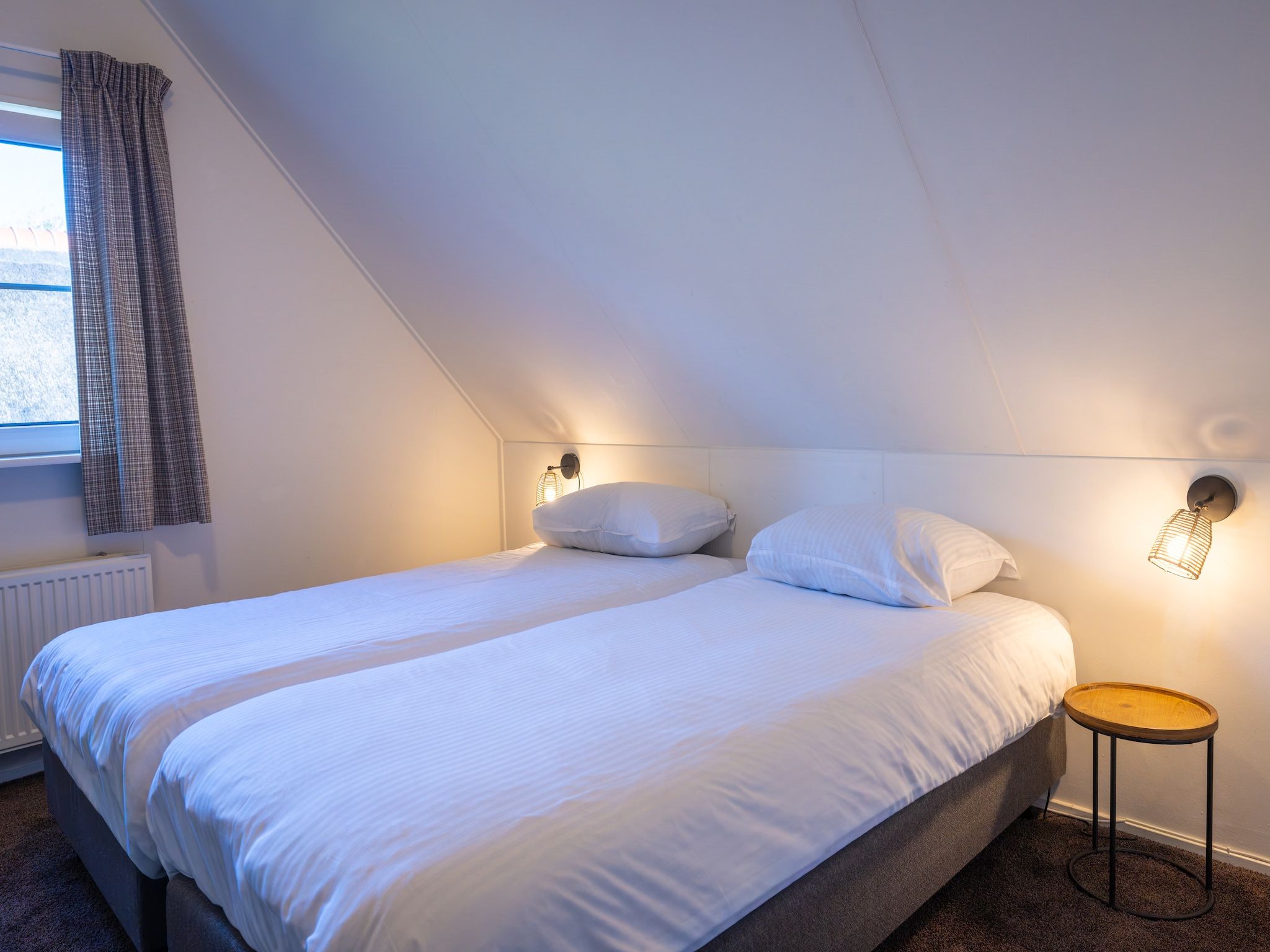 Een slaapkamer van Villapark De Weerribben 4 in Paasloo