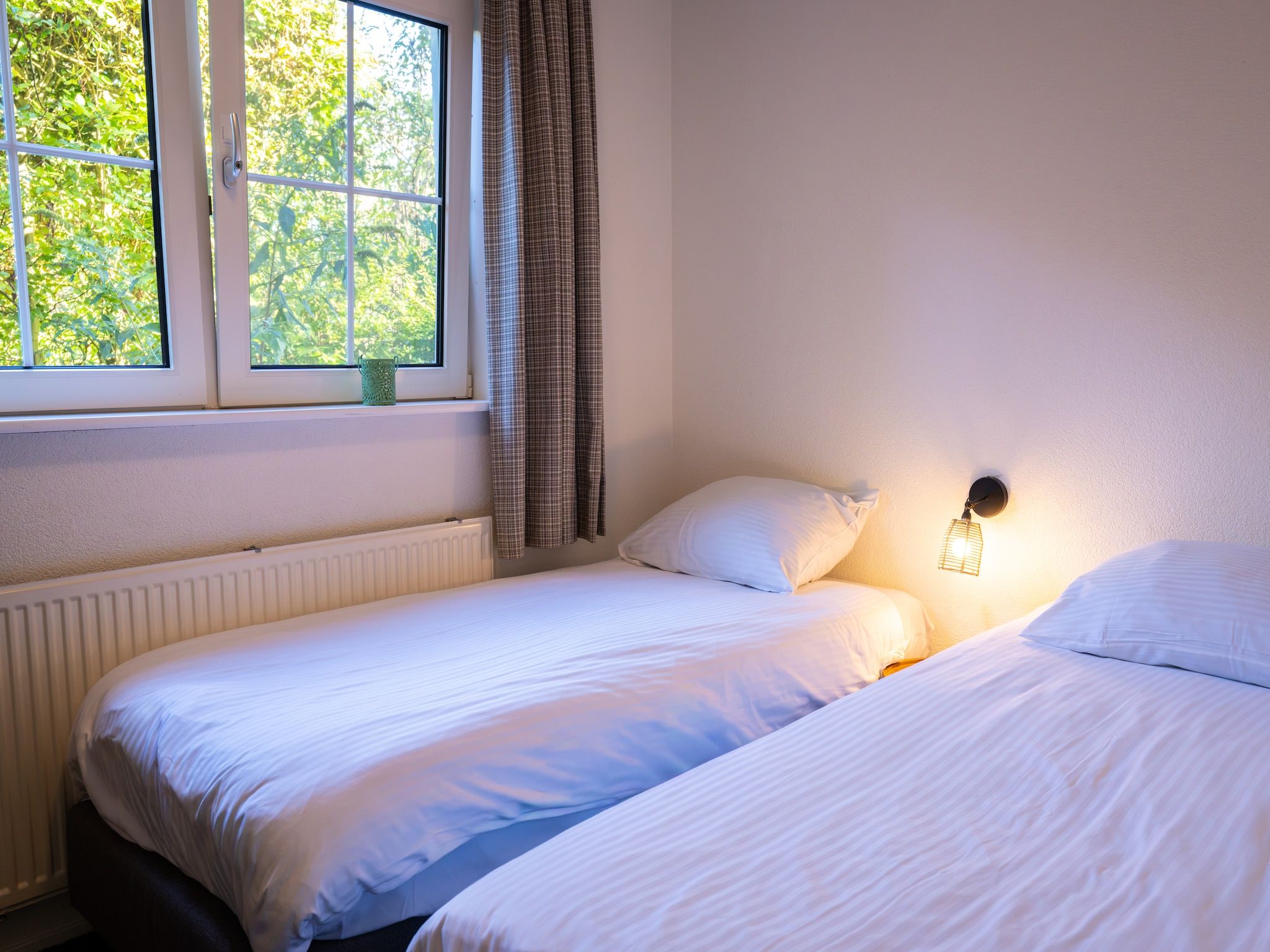 Een slaapkamer van Villapark De Weerribben 4 in Paasloo
