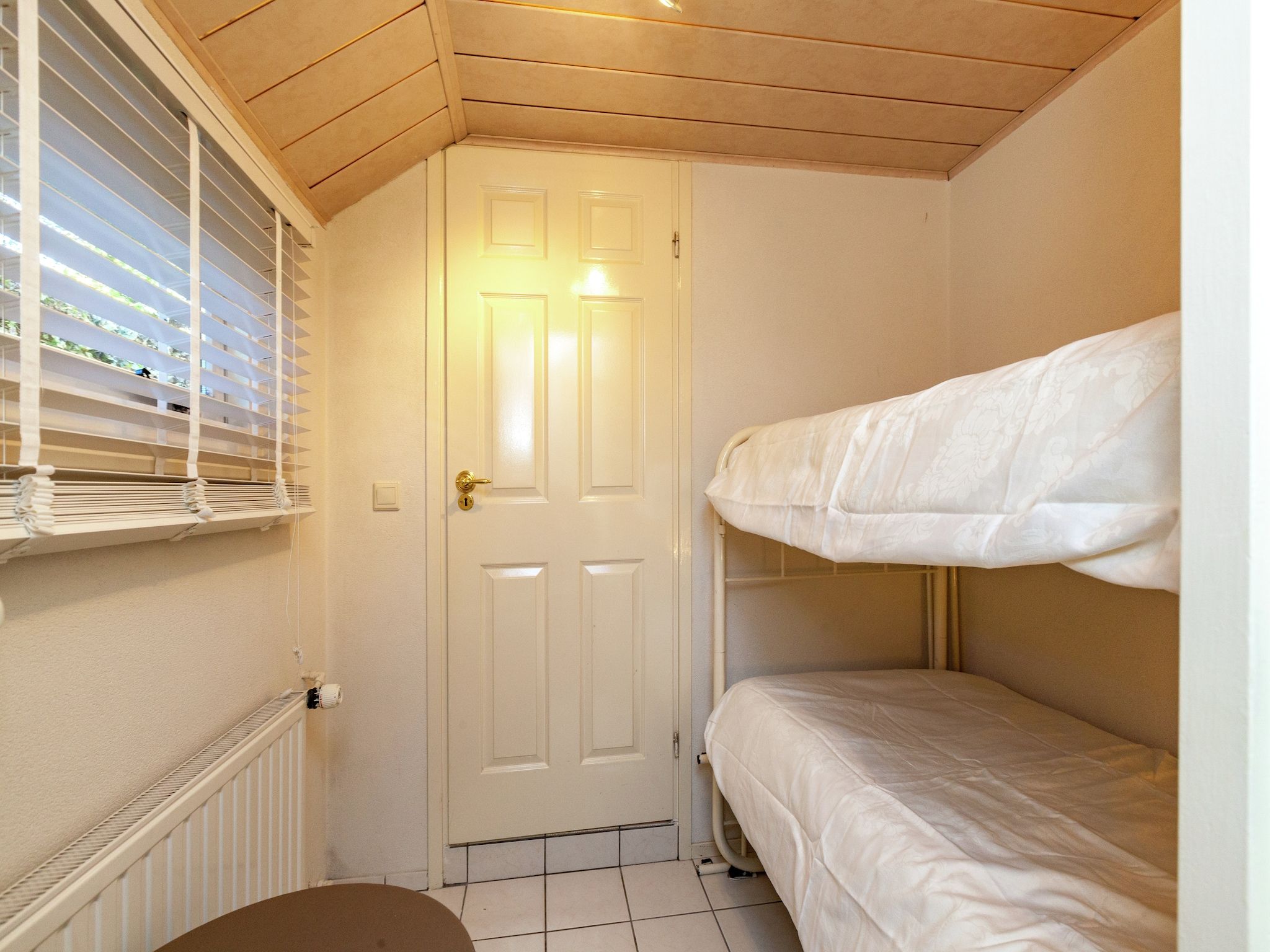 Een slaapkamer van Vier Duinen in Oostkapelle