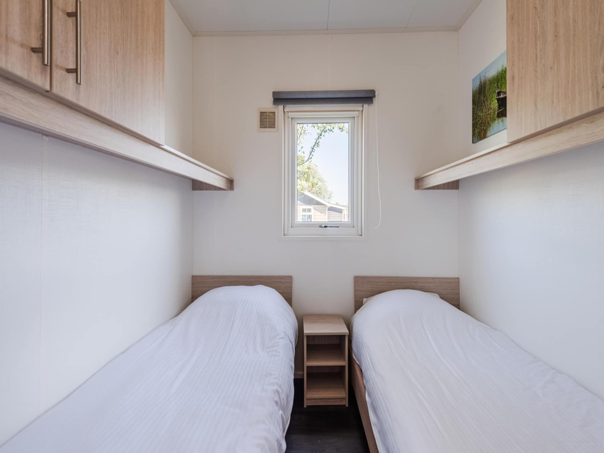 Een slaapkamer van Vakantiepark Giethoorn 3 in Giethoorn