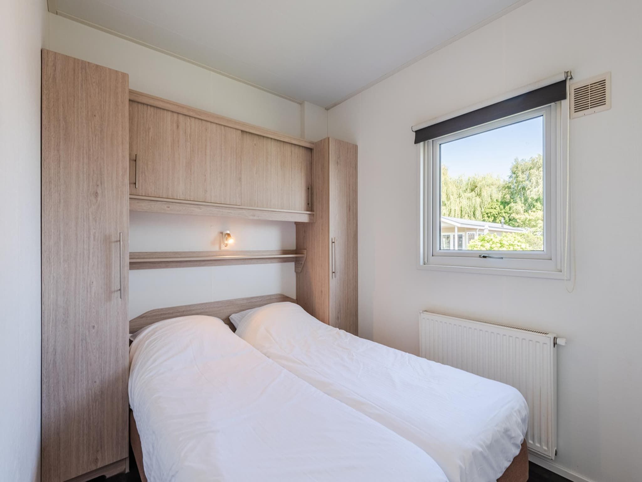 Een slaapkamer van Vakantiepark Giethoorn 3 in Giethoorn