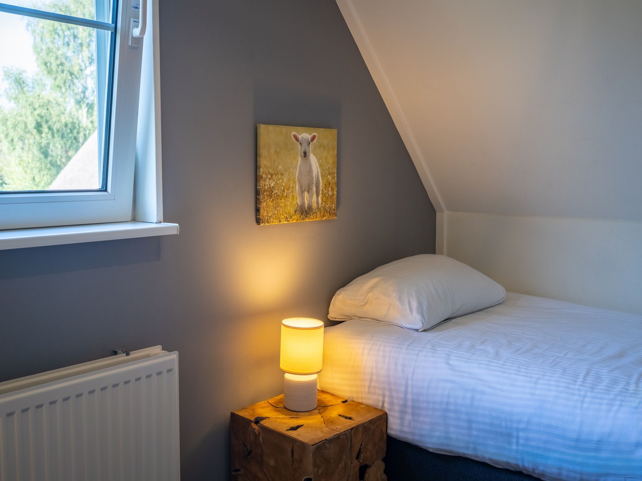 Een slaapkamer van Villapark De Weerribben 5 in Paasloo