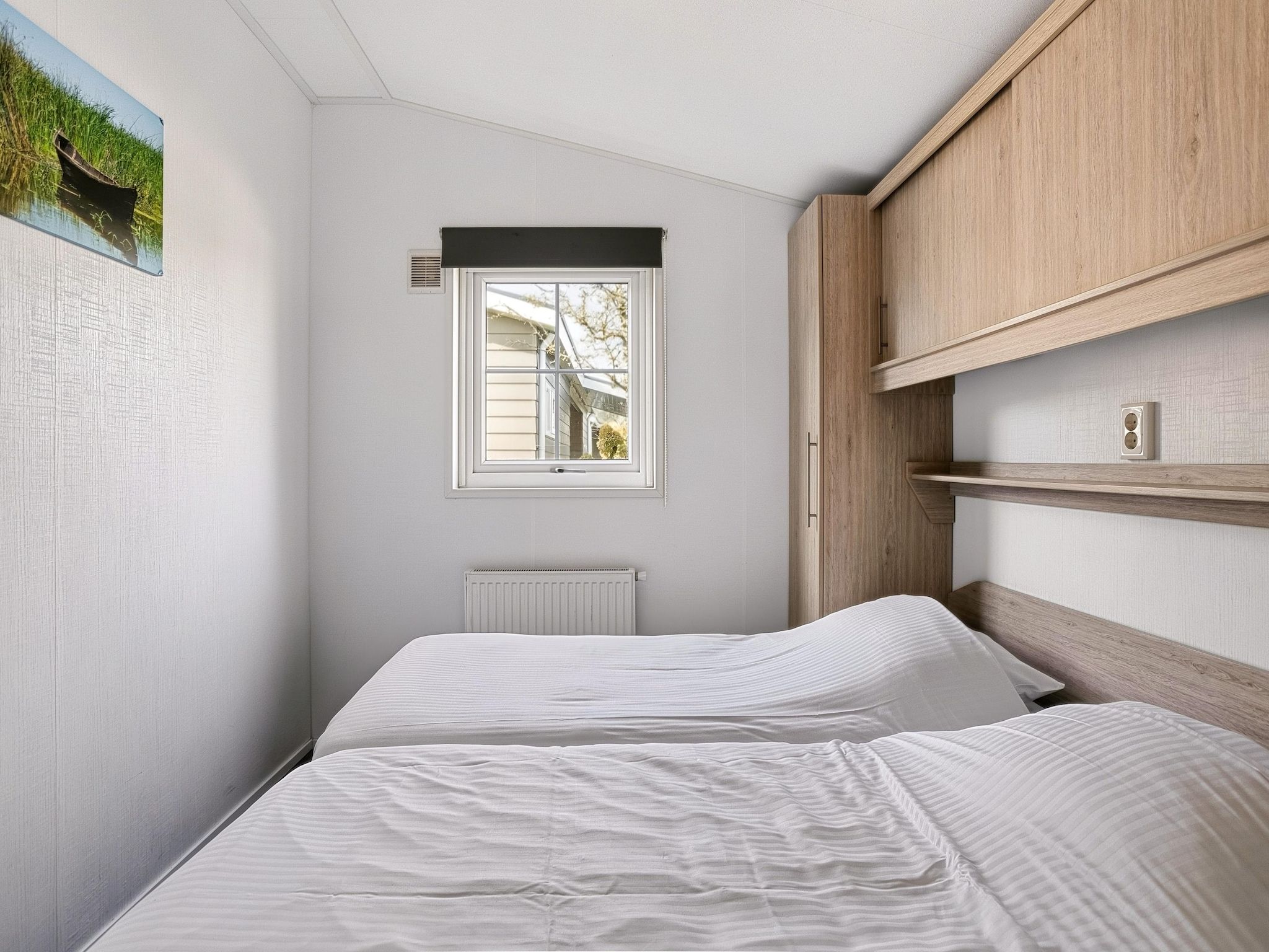 Een slaapkamer van Vakantiepark Giethoorn 4 in Giethoorn