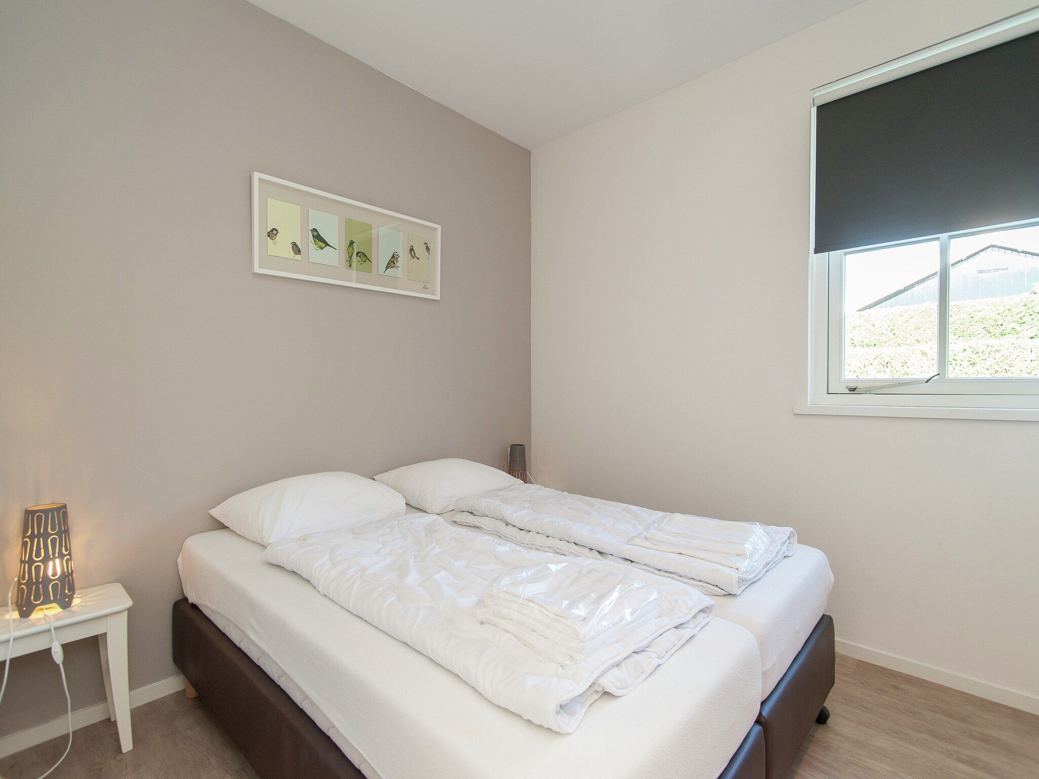 Een slaapkamer van Bungalowpark de Gouden Spar 3 in Noordwijk