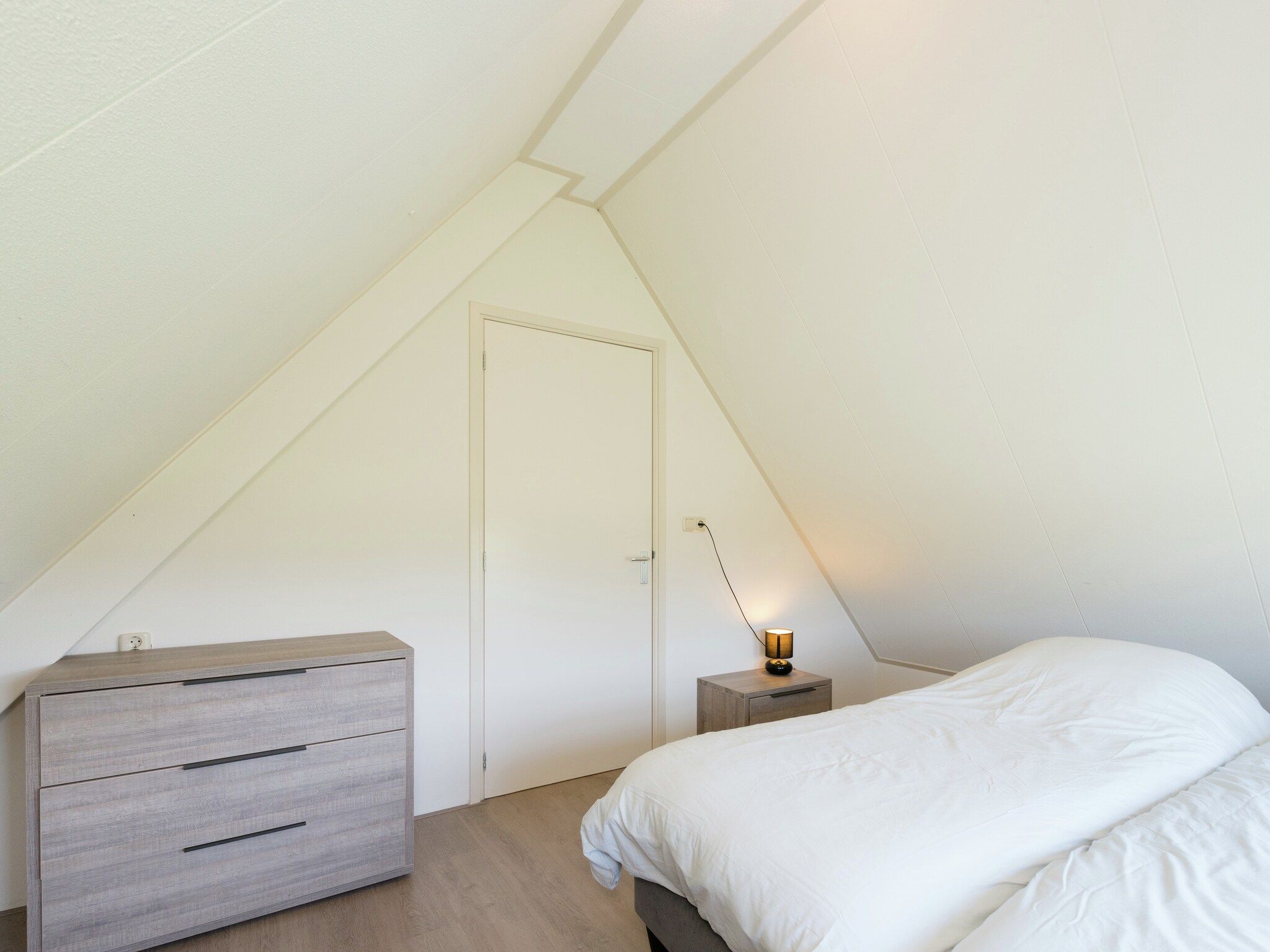Een slaapkamer van De Grutto in Hippolytushoef