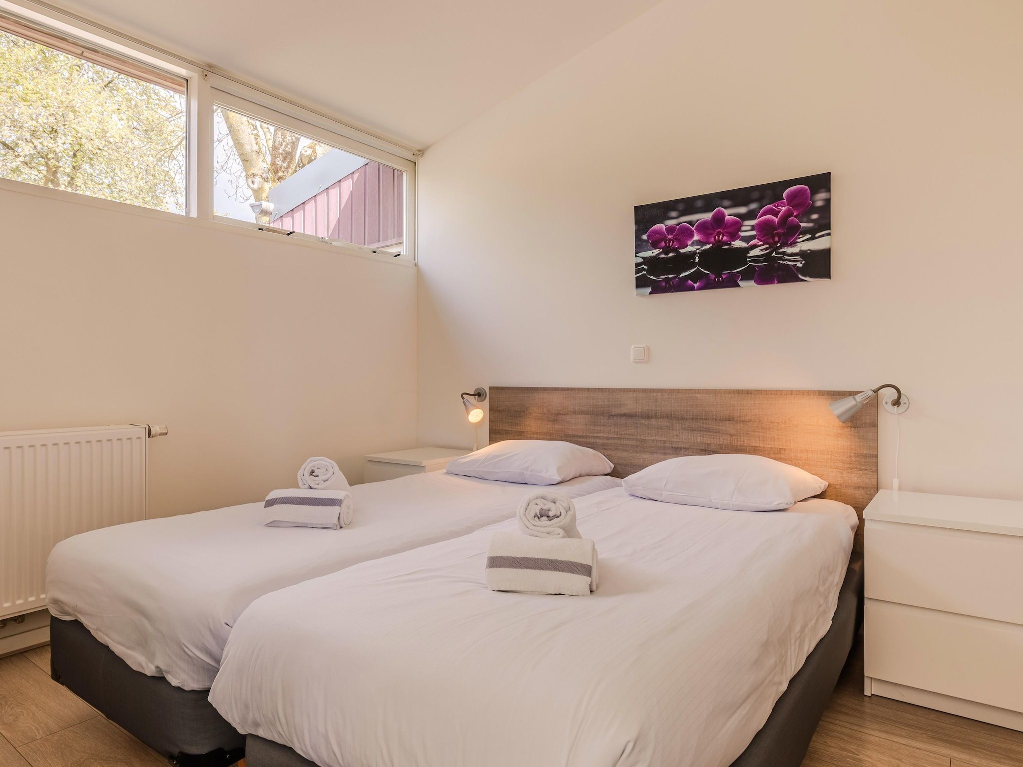 Een slaapkamer van Bungalowpark Schin op Geul 3 in Walem