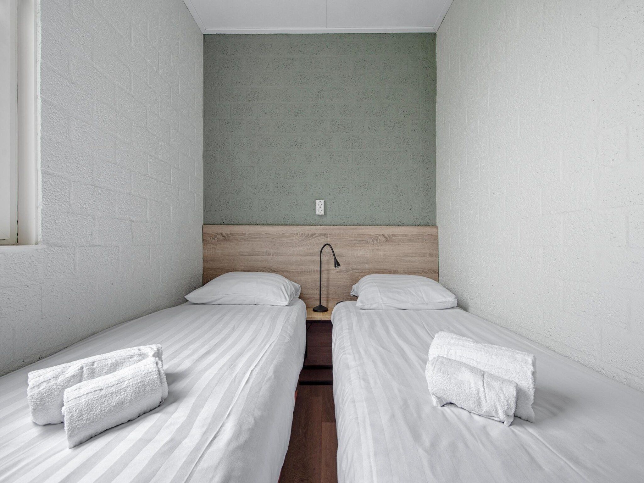 Een slaapkamer van Bungalowpark Schin op Geul 9 in Walem
