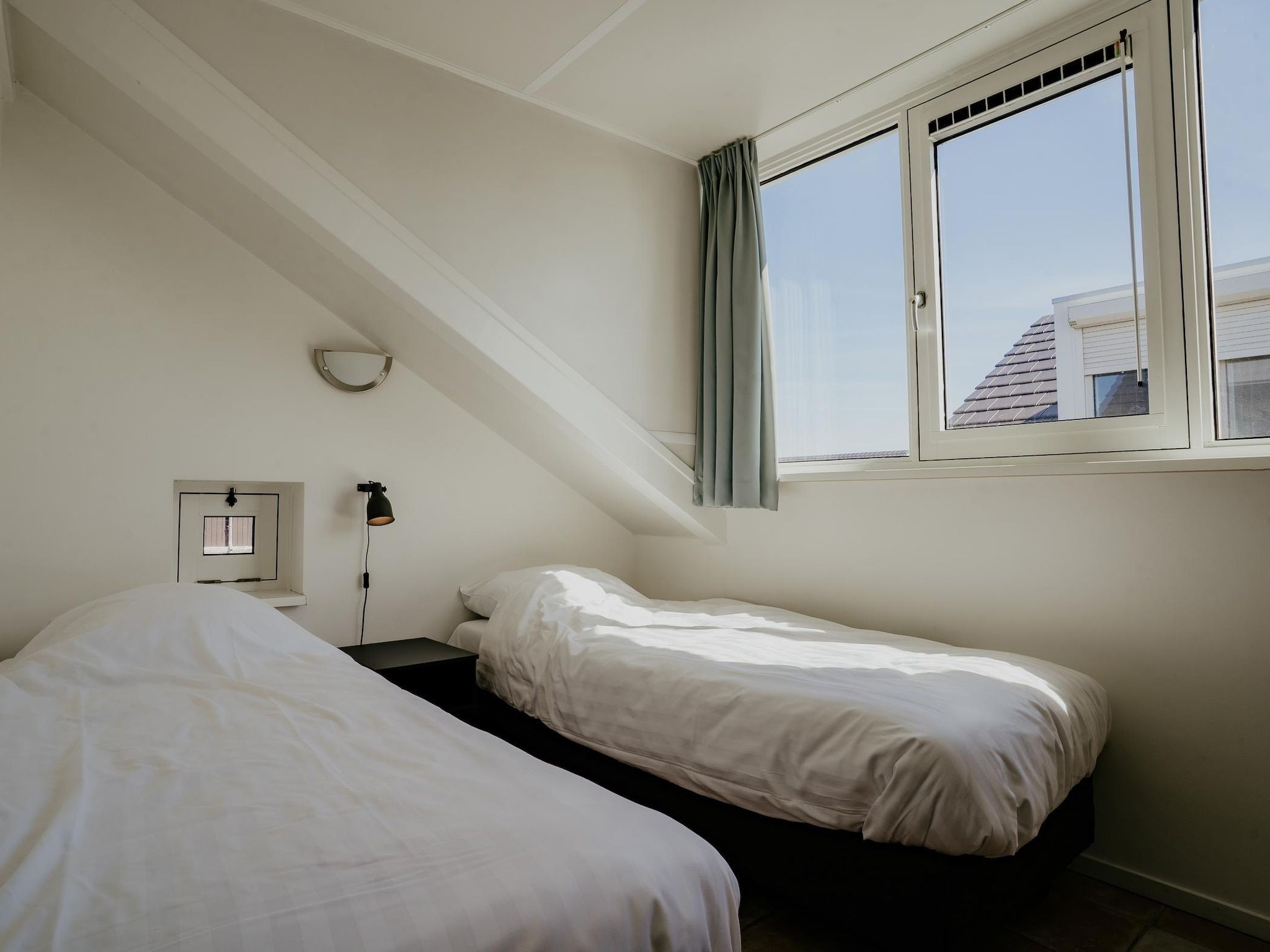 Een slaapkamer van Waterpark de Meerparel 4 in Uitgeest