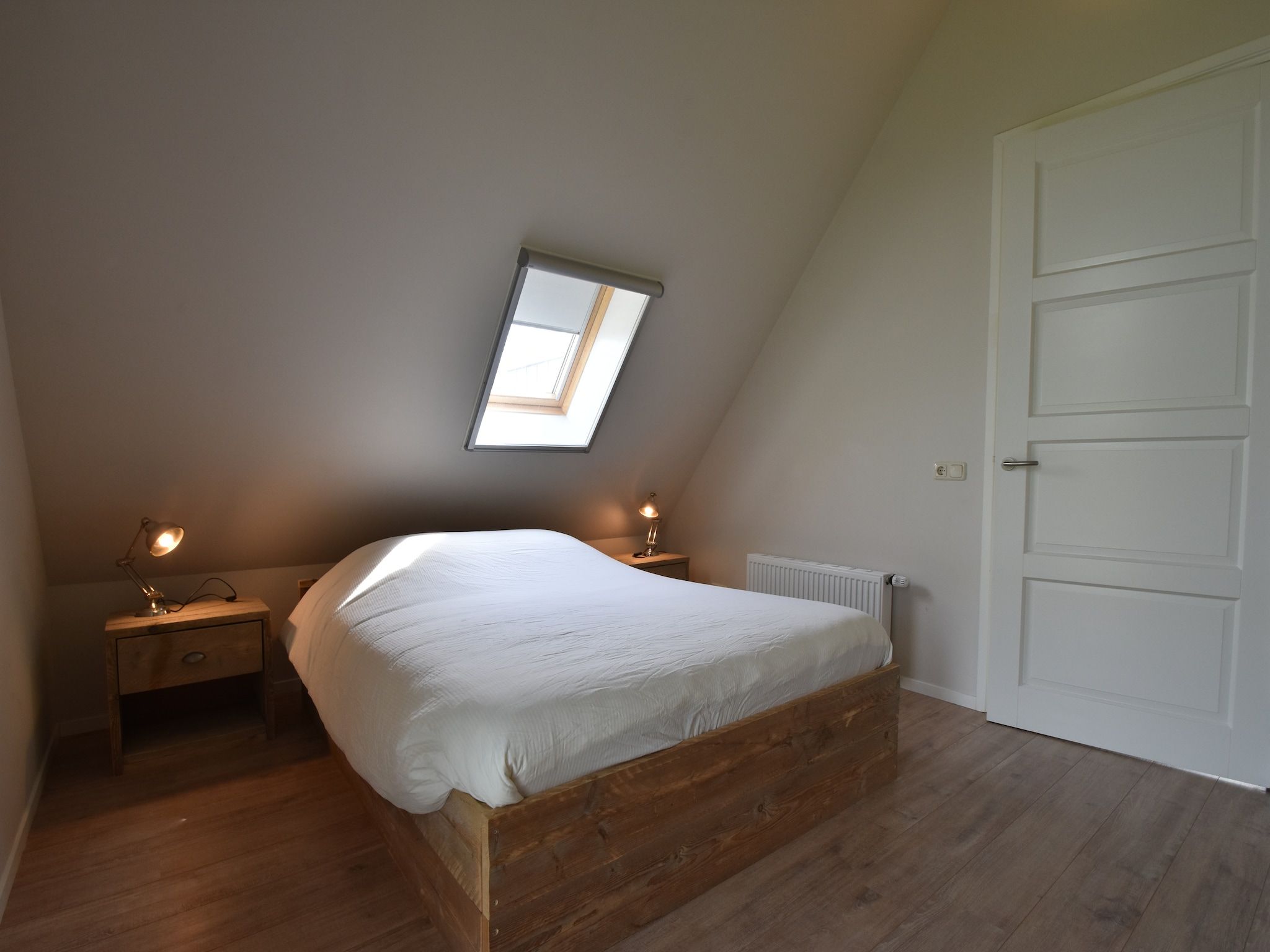 Een slaapkamer van Zeedijk III in Tzummarum