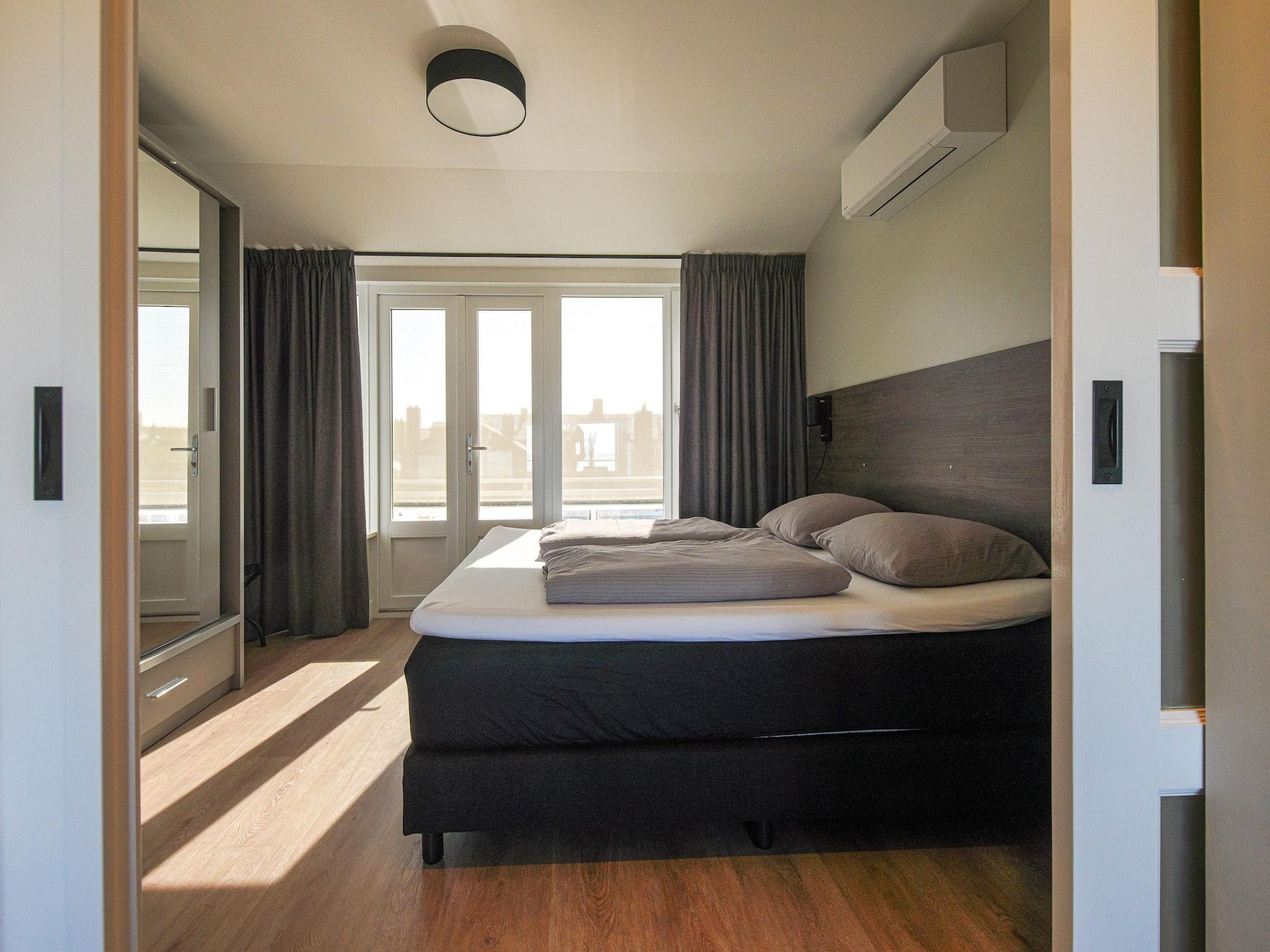 Een slaapkamer van Ziezee in Katwijk