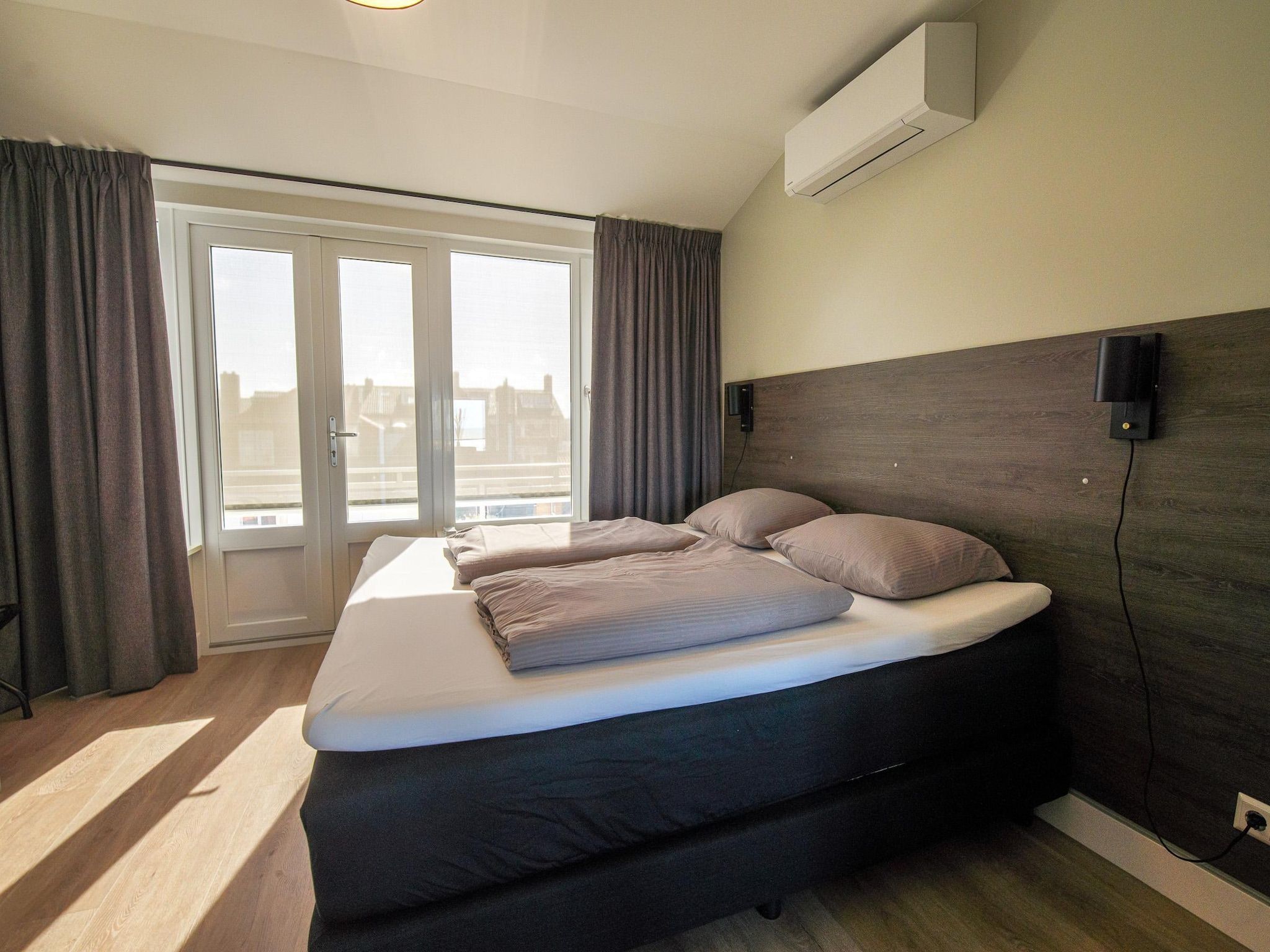 Een slaapkamer van Ziezee in Katwijk
