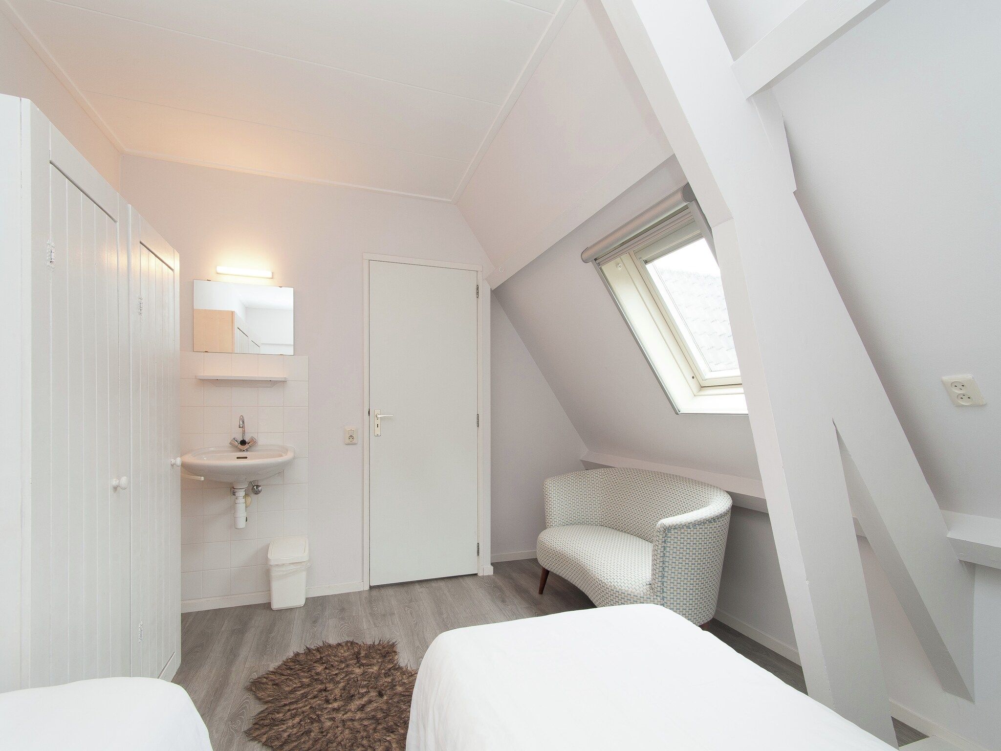 Een slaapkamer van Huize Glory Parel in Bergen aan zee