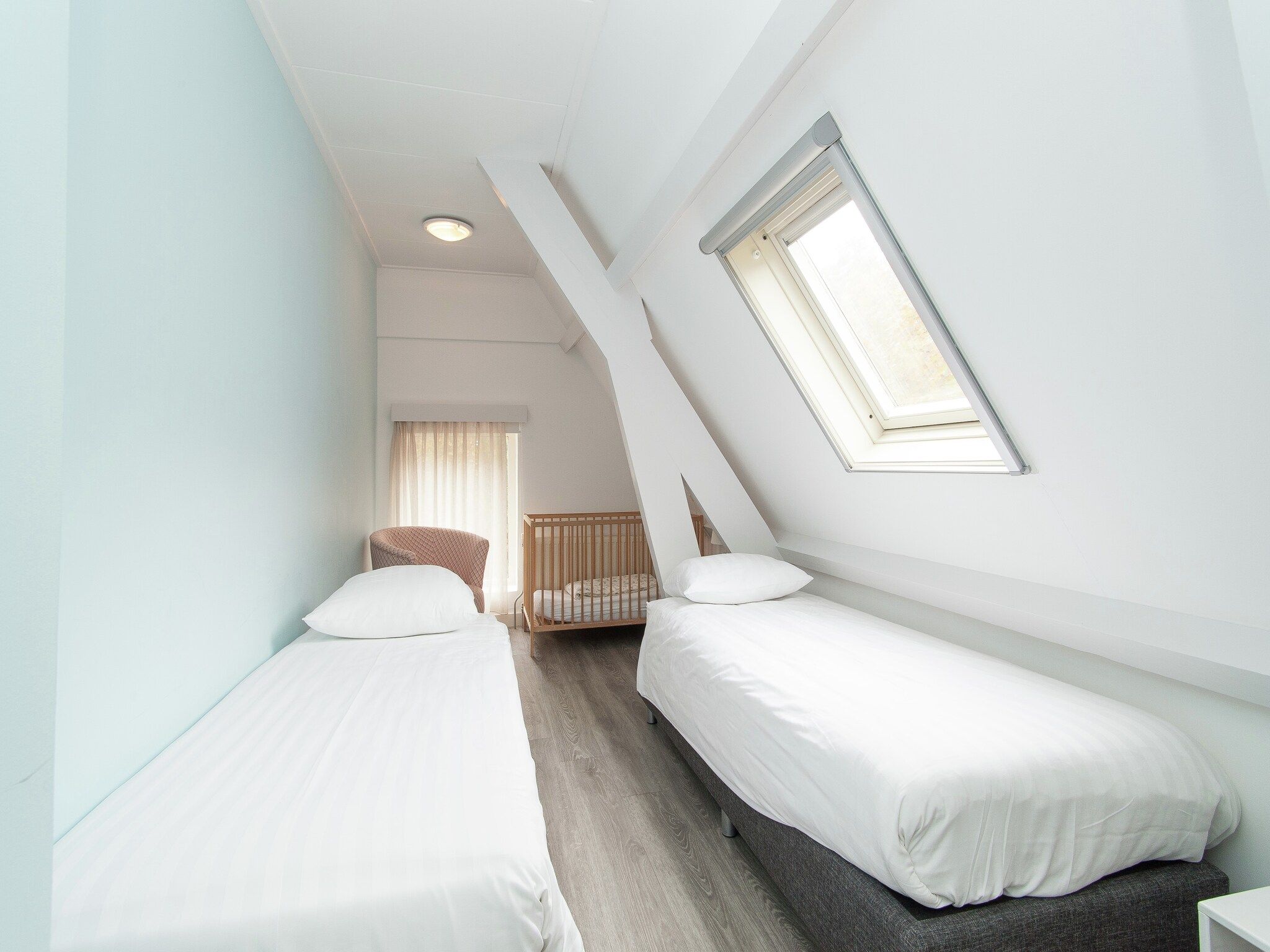 Een slaapkamer van Huize Glory Parel in Bergen aan zee