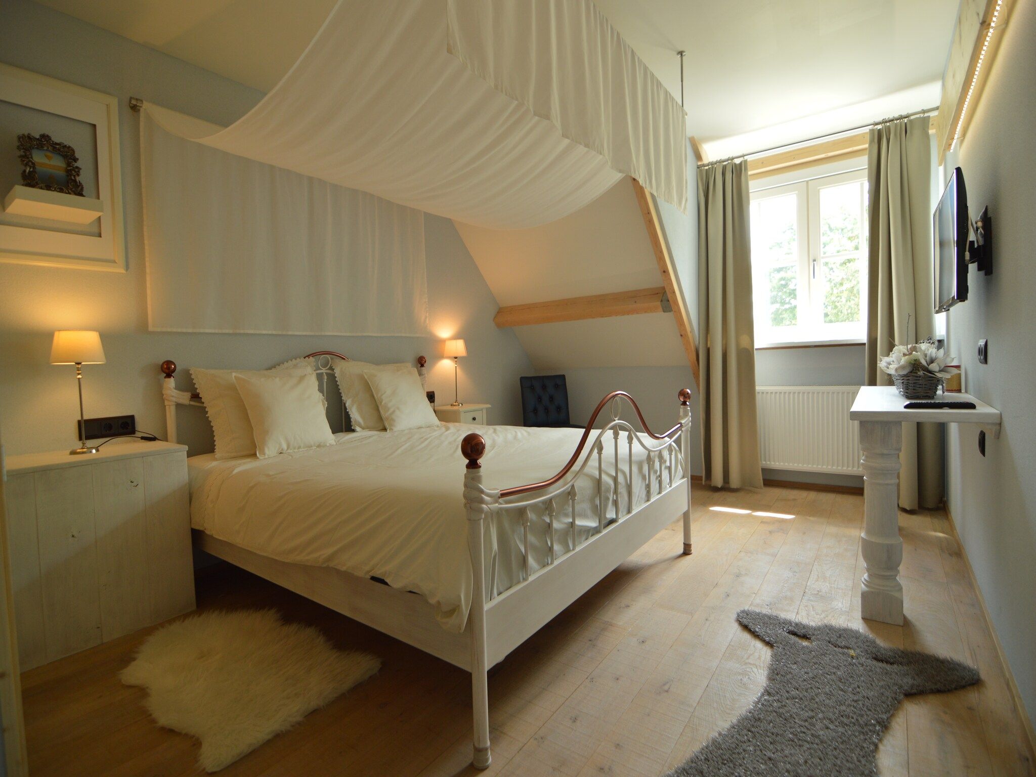 Een slaapkamer van Tramutana in Haaren