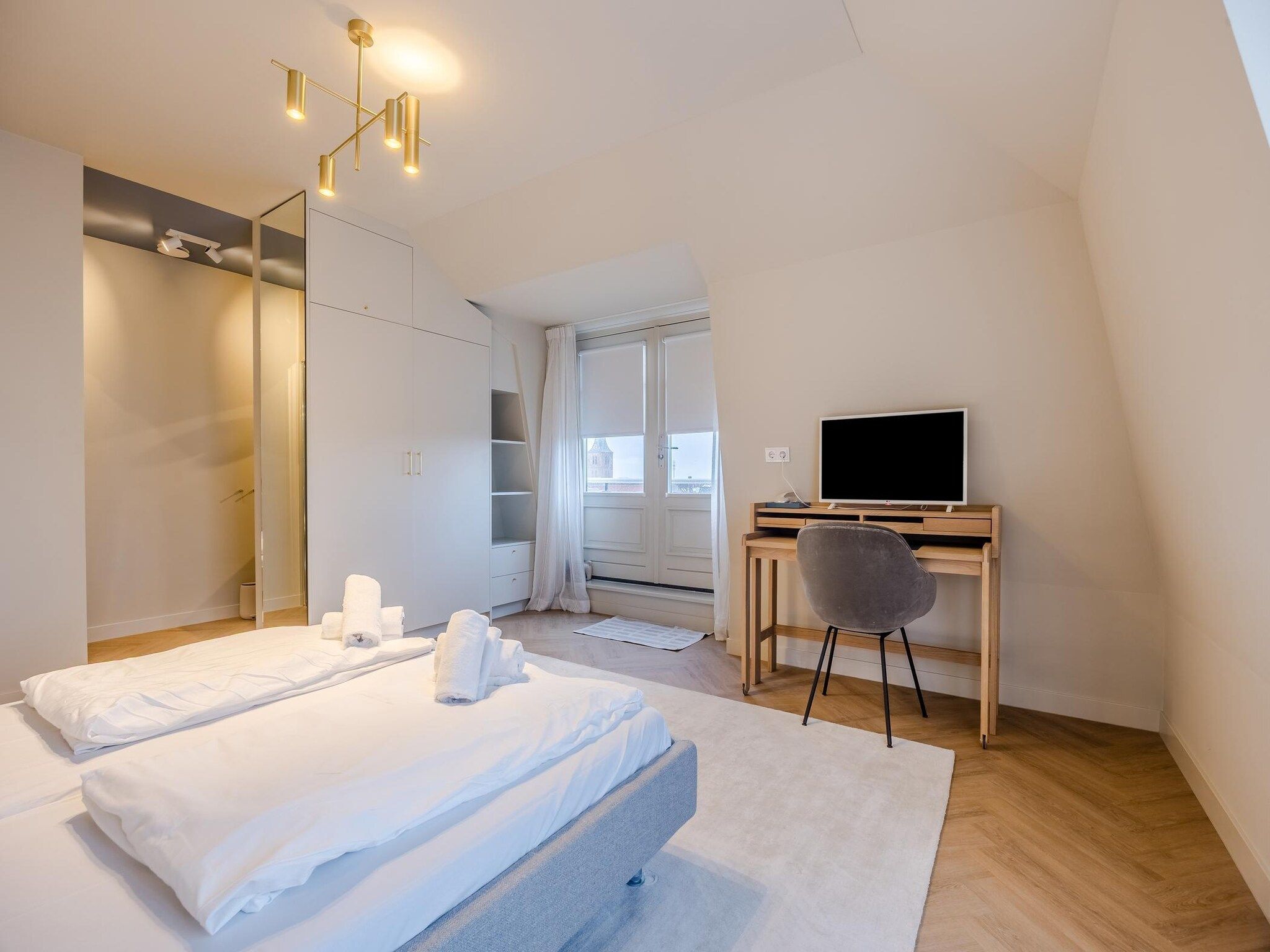 Een slaapkamer van Résidence Wijngaerde 10 in Domburg