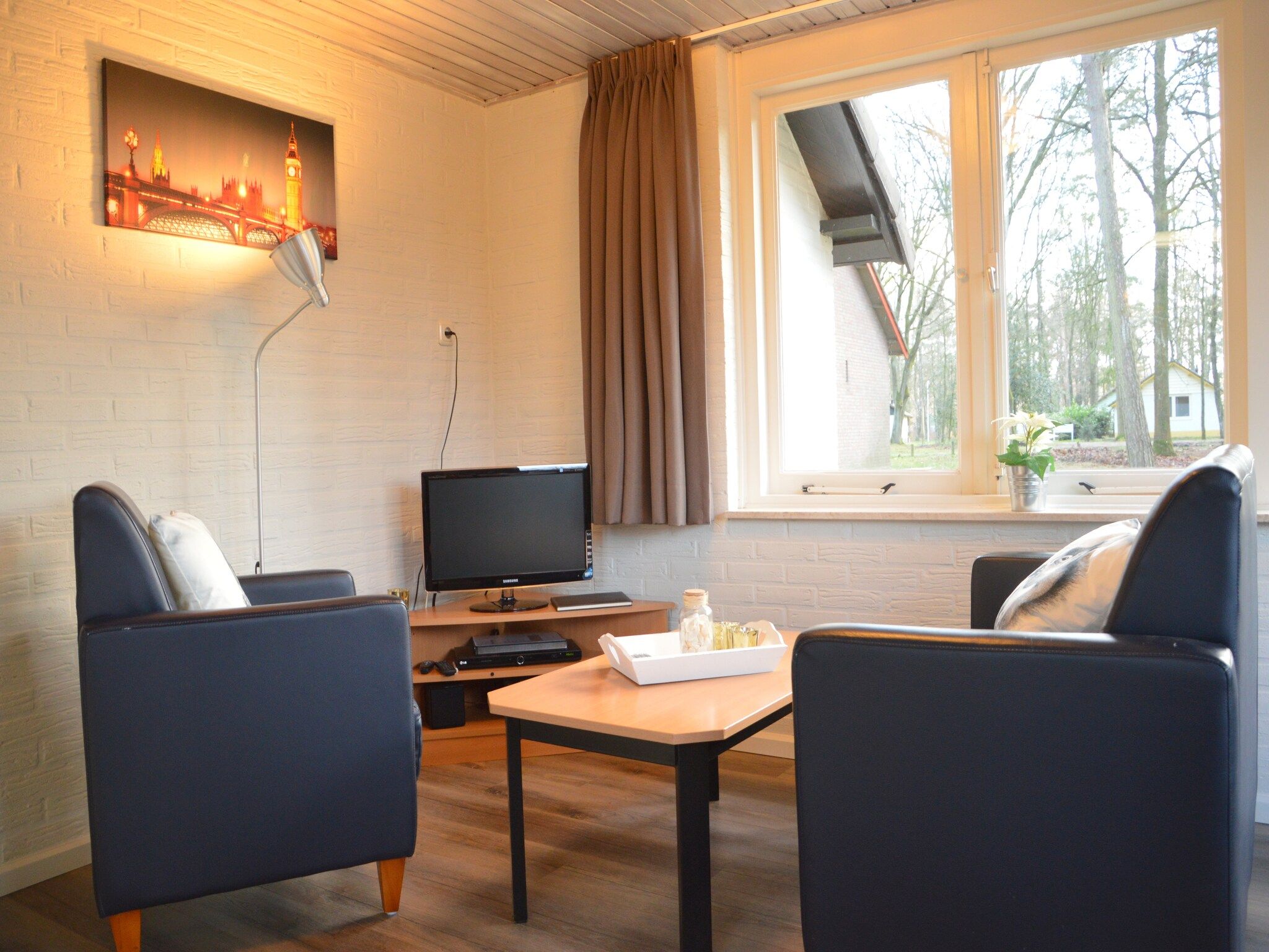 De woonkamer van Bungalow 27 in Stramproy