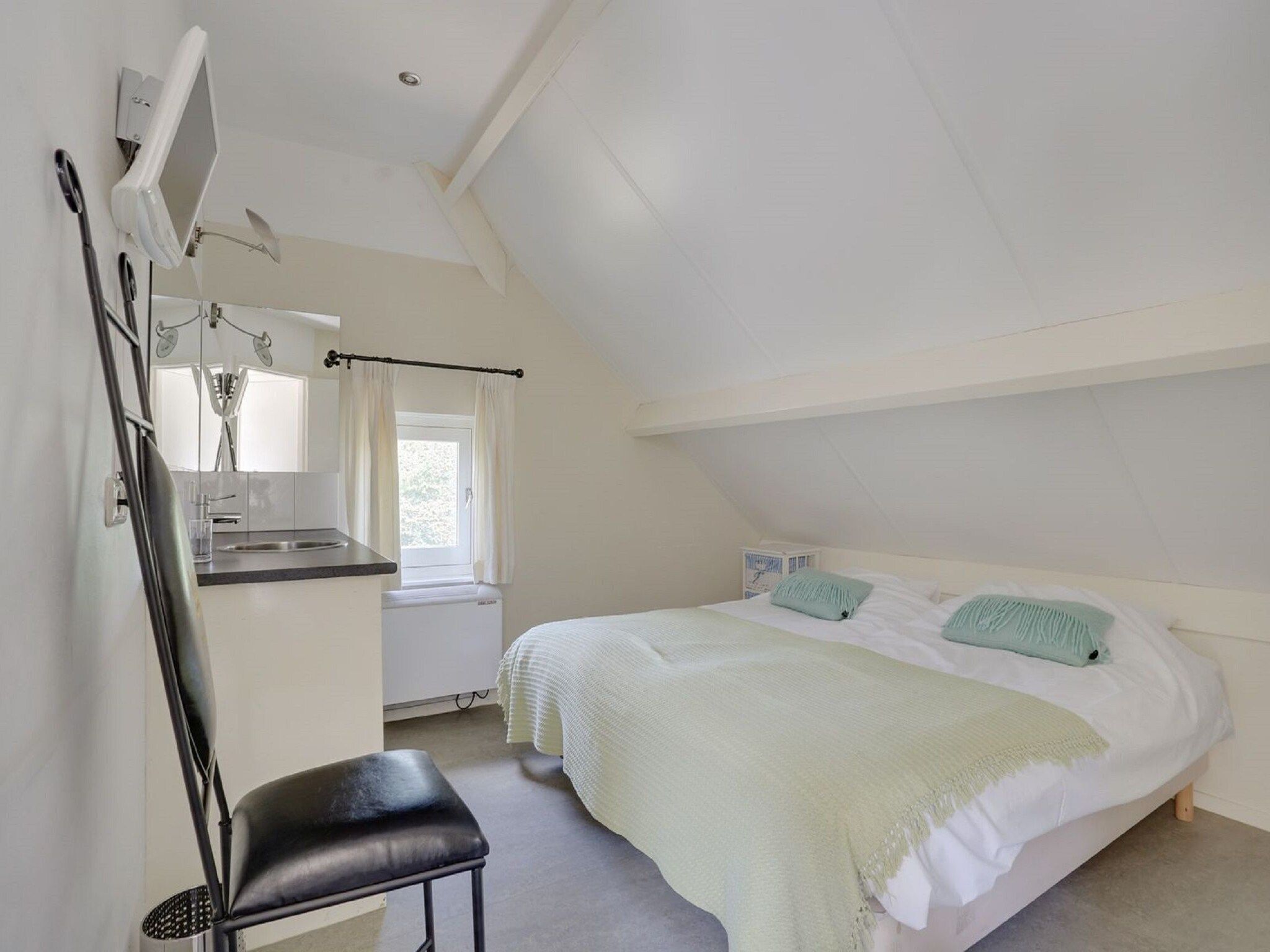 Een slaapkamer van Vakantiepark Sandberghe 2 in Uden