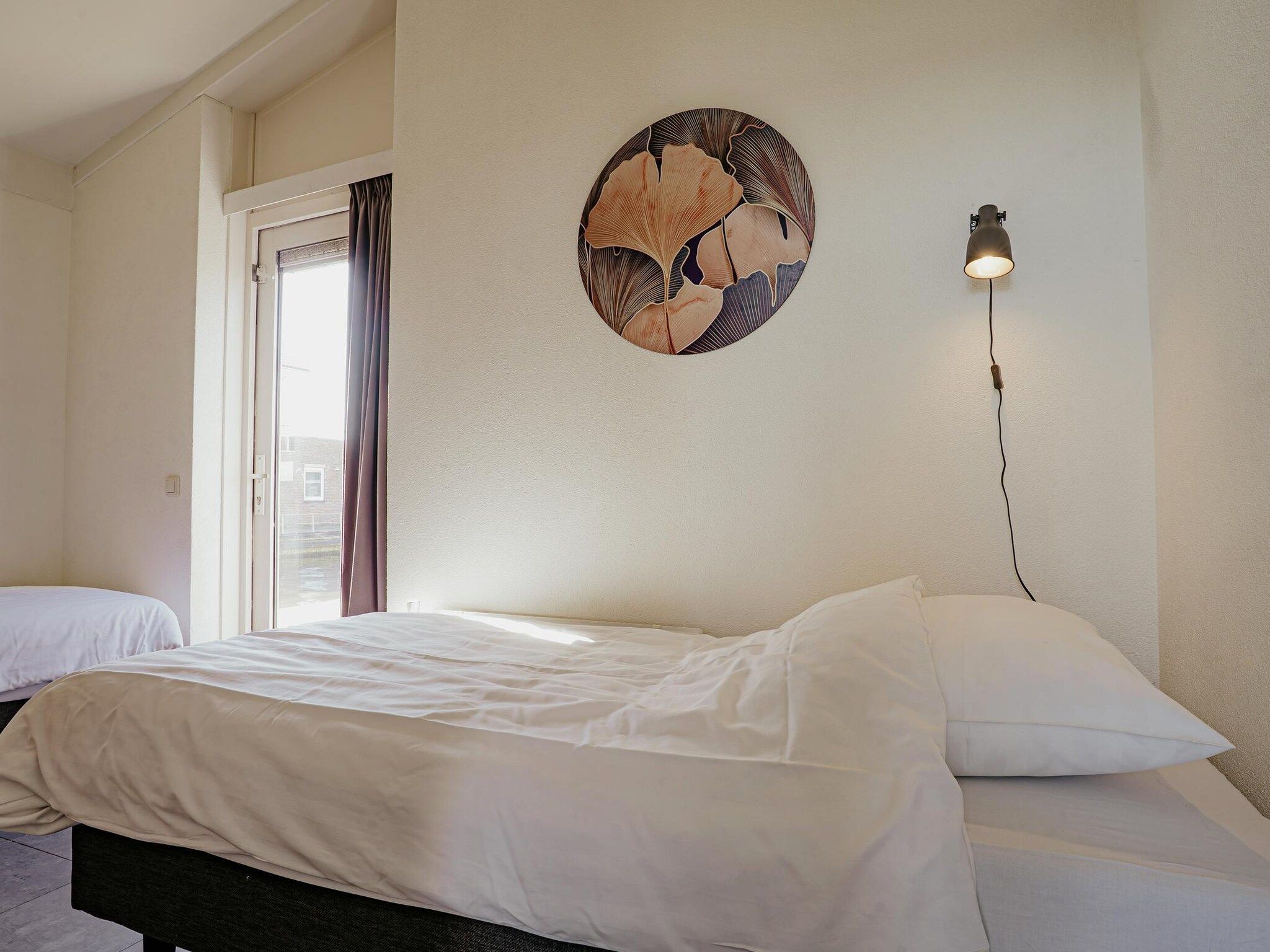 Een slaapkamer van Waterpark de Meerparel 2 in Uitgeest