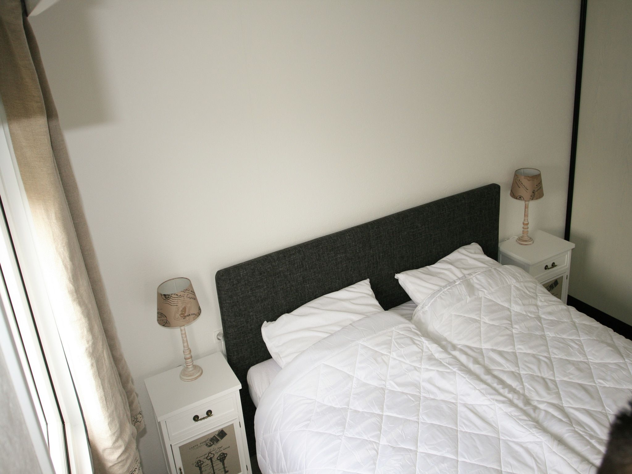 Een slaapkamer van Recreatiepark Wiringherlant - Wiringher Chalet 10 in Hippolytushoef