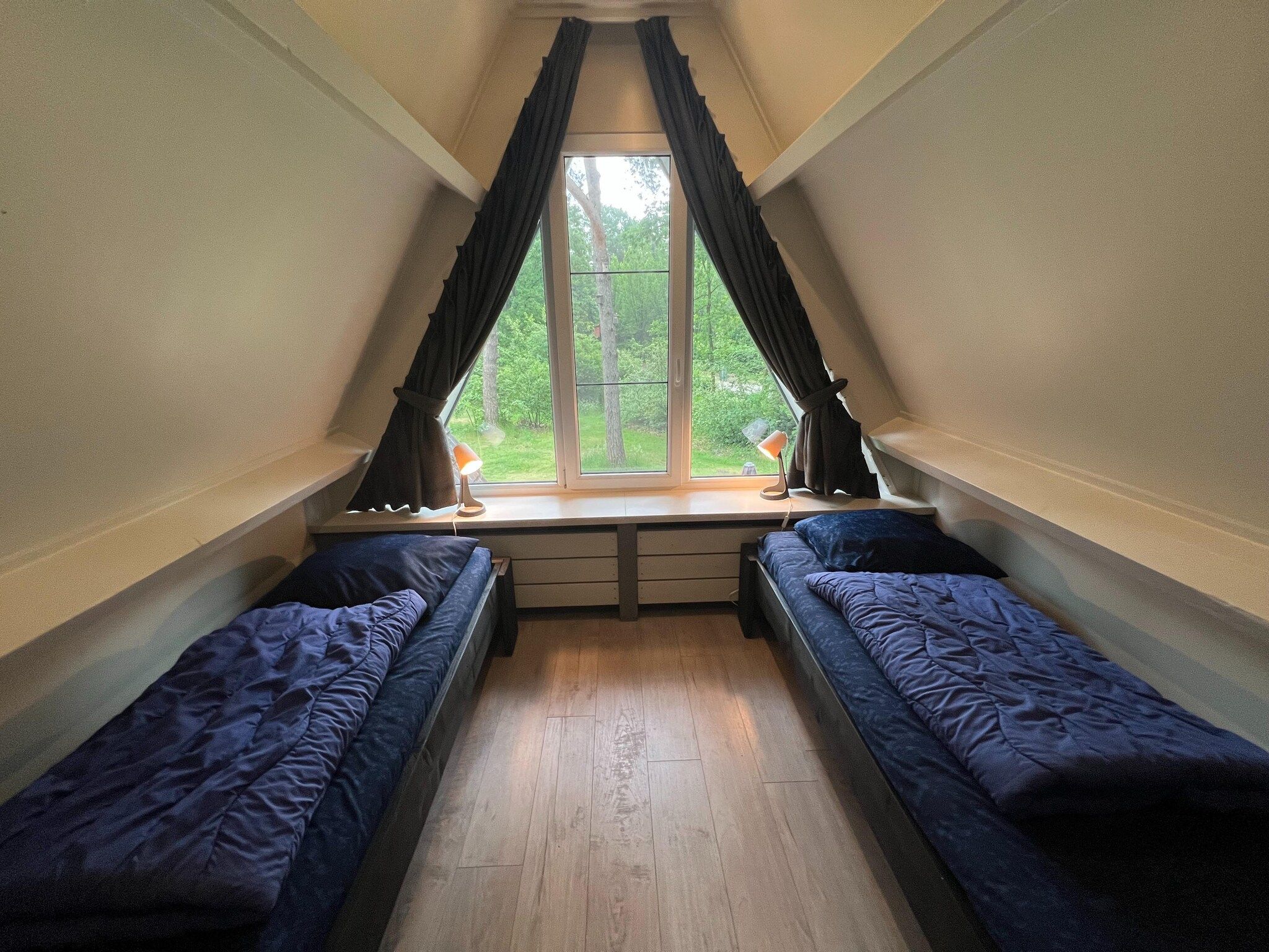 Een slaapkamer van Vosseven 84 Moseik in Stramproy