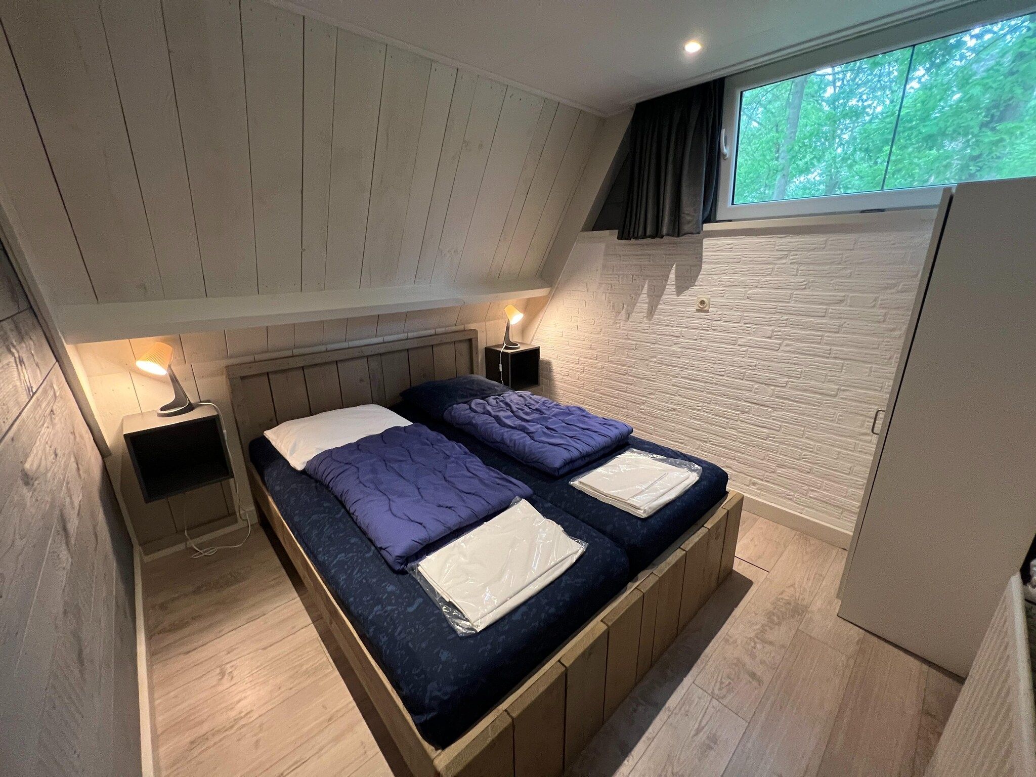 Een slaapkamer van Vosseven 84 Moseik in Stramproy