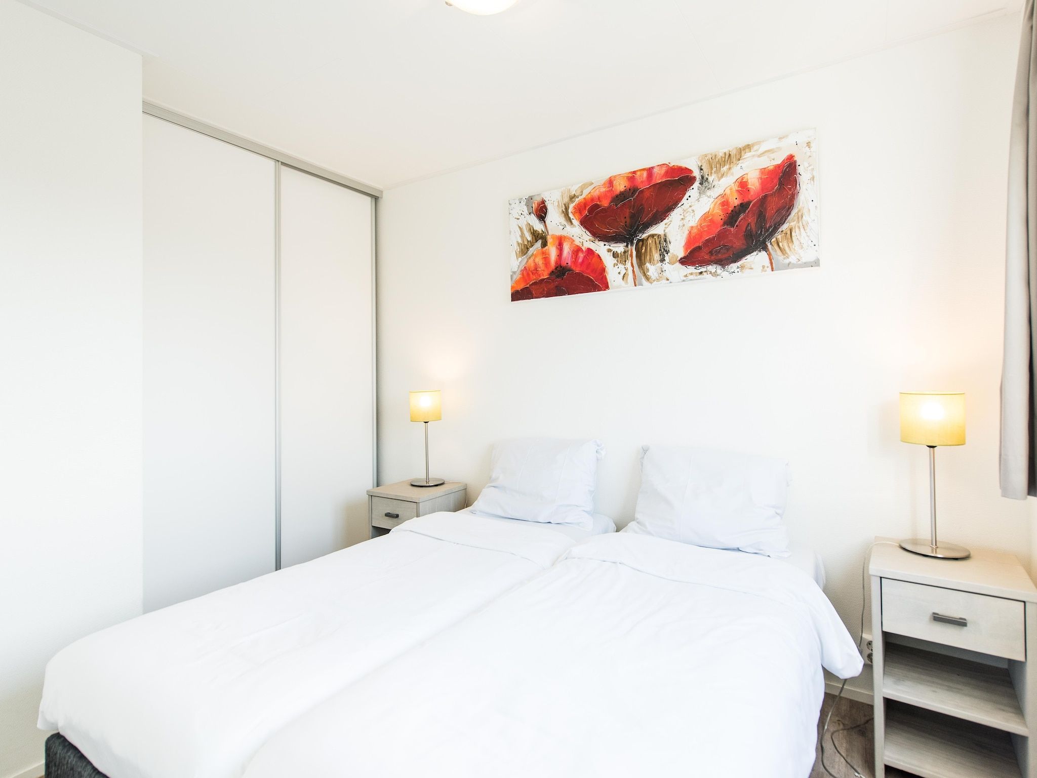 Een slaapkamer van Vakantiepark Boomhiemke 6 in Hollum-Ameland