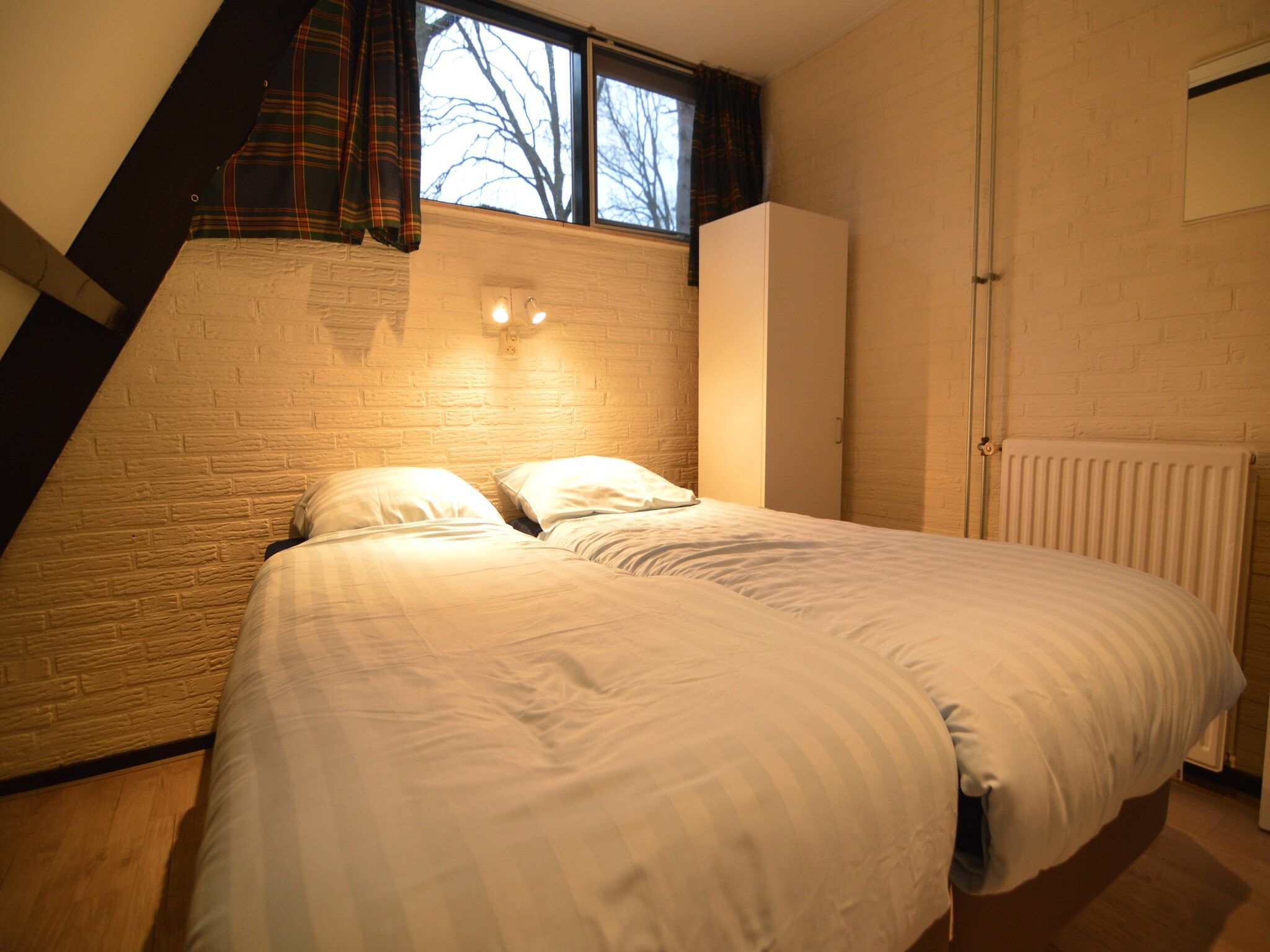 Een slaapkamer van Vosseven 85 Muizeoortje in Stramproy