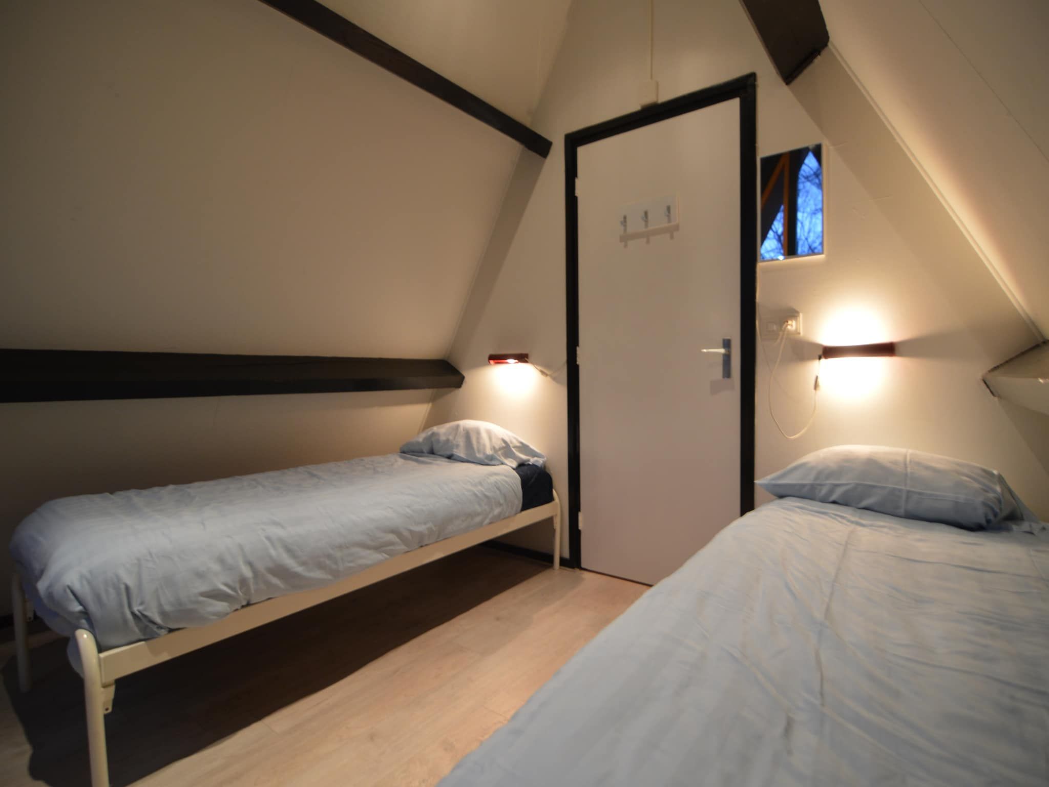Een slaapkamer van Vosseven 85 Muizeoortje in Stramproy