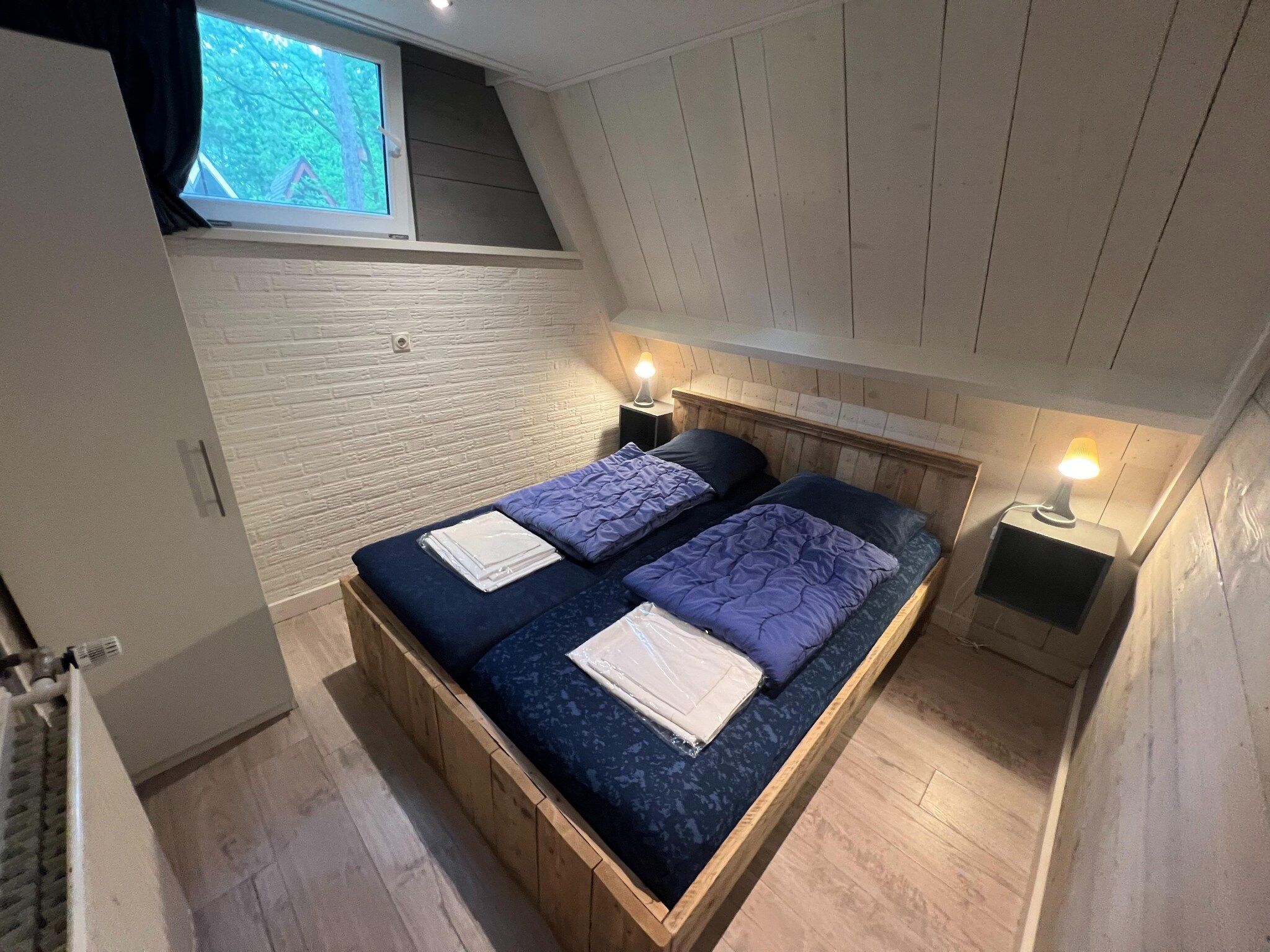 Een slaapkamer van Vosseven 85 Muizeoortje in Stramproy