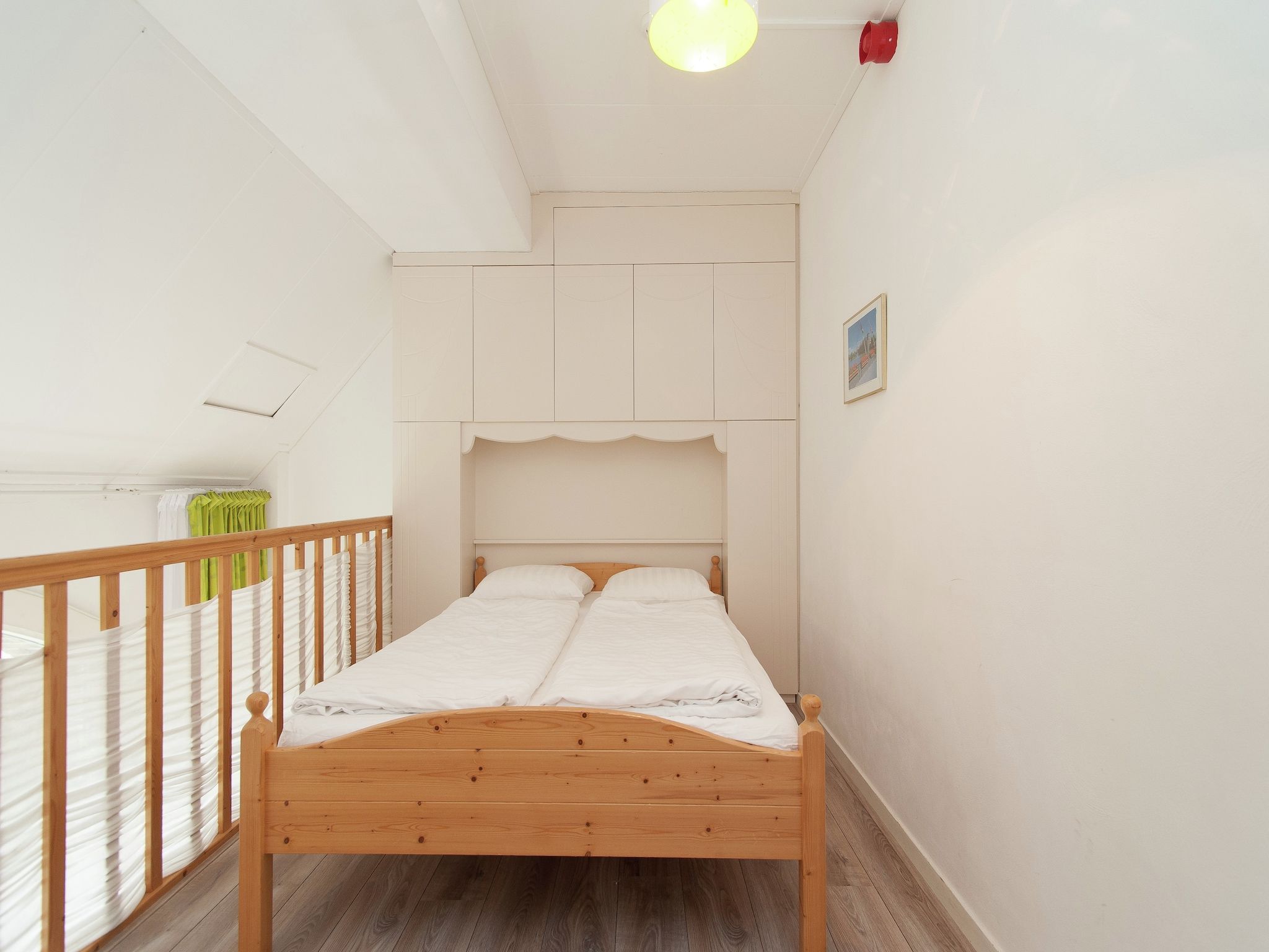 Een slaapkamer van Huize Glory Citrien in Bergen aan zee