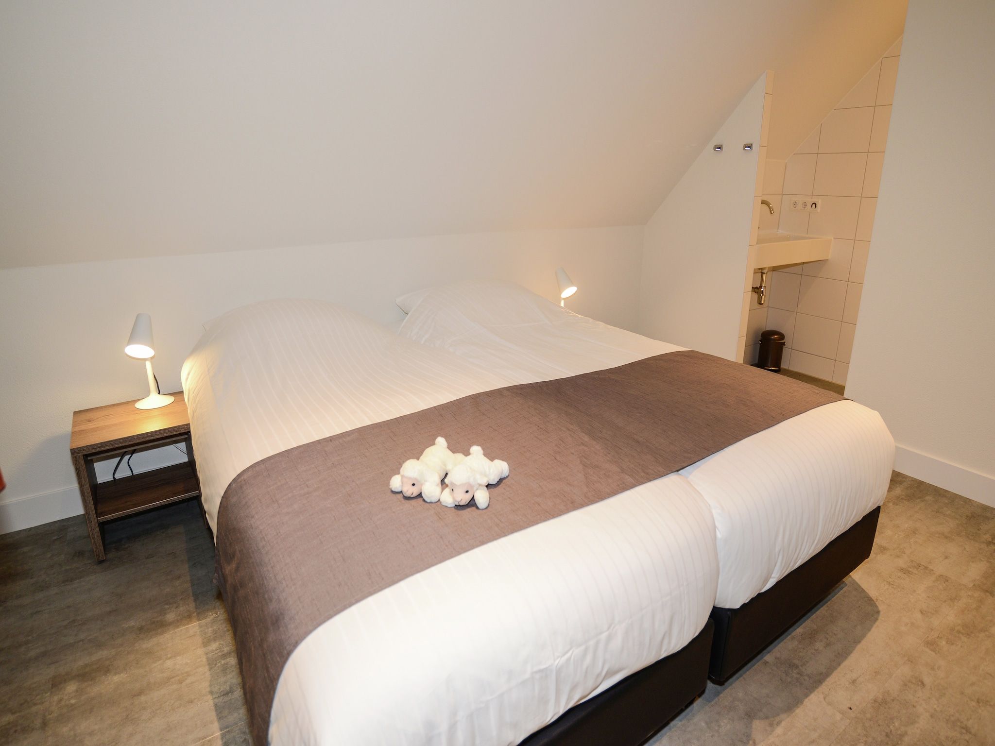 Een slaapkamer van Tempelier 39 in Den Burg-Texel