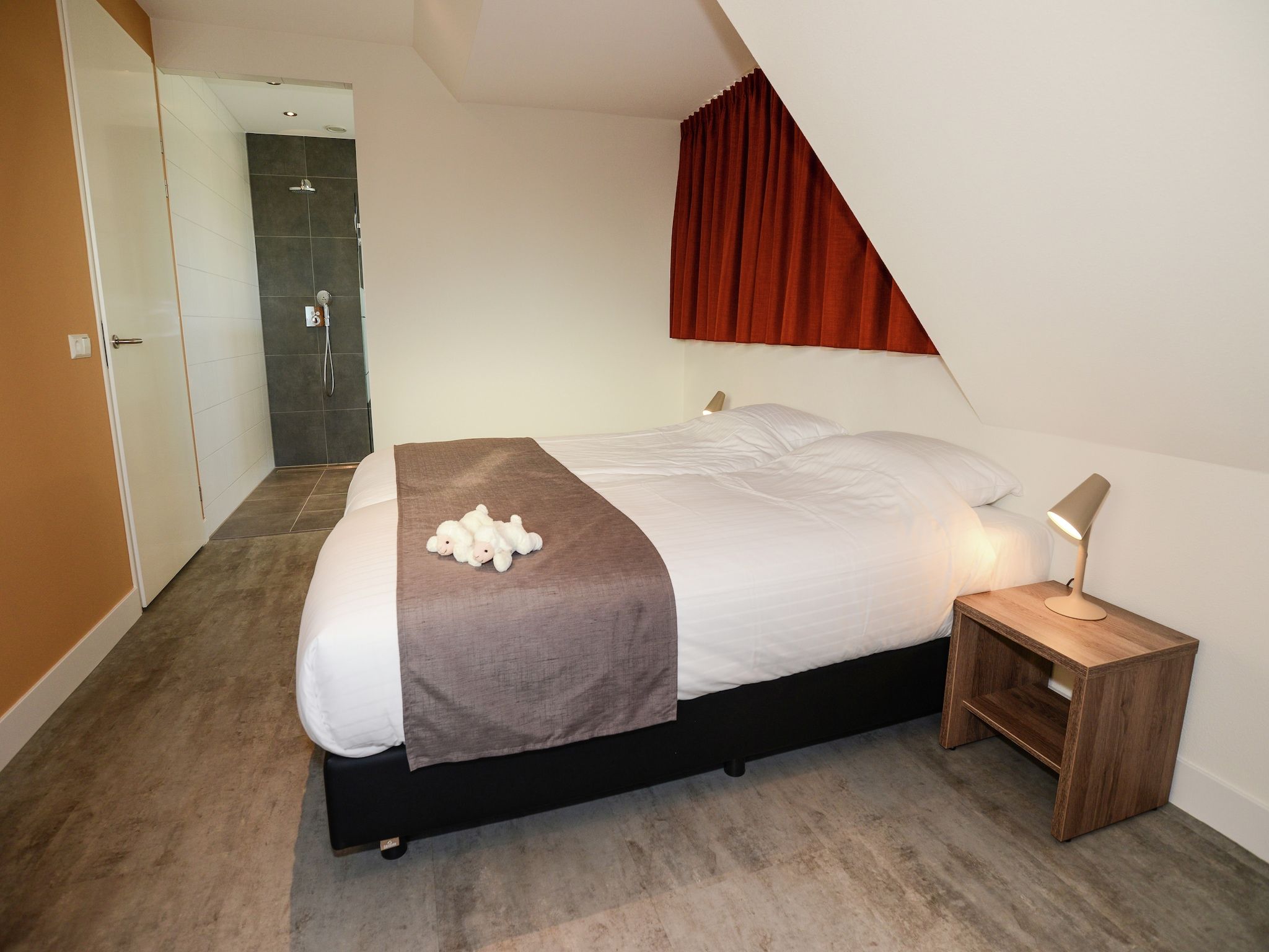 Een slaapkamer van Tempelier 39 in Den Burg-Texel