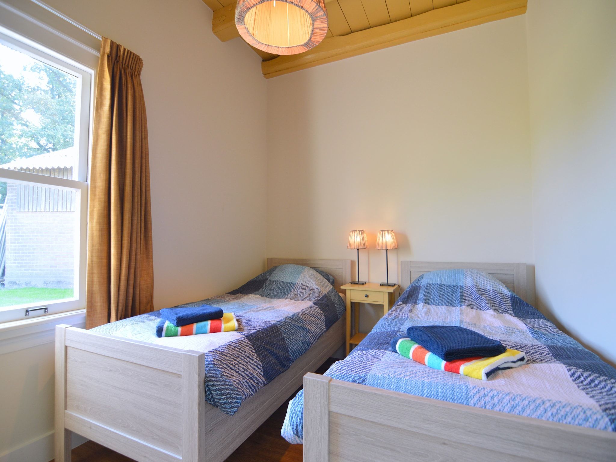 Een slaapkamer van Bakhuus in Geesteren