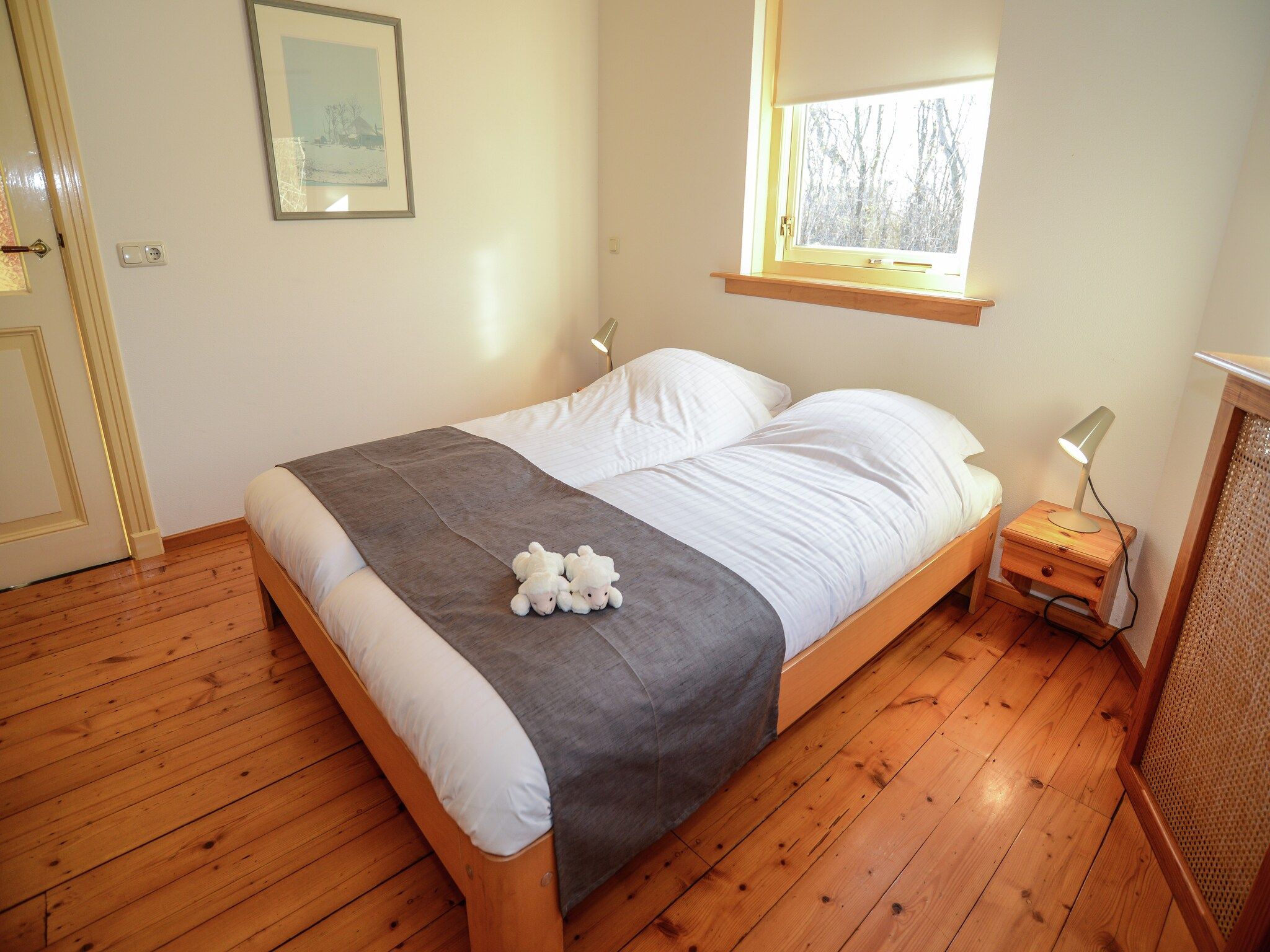 Een slaapkamer van De Kerkuil in De Cocksdorp-Texel