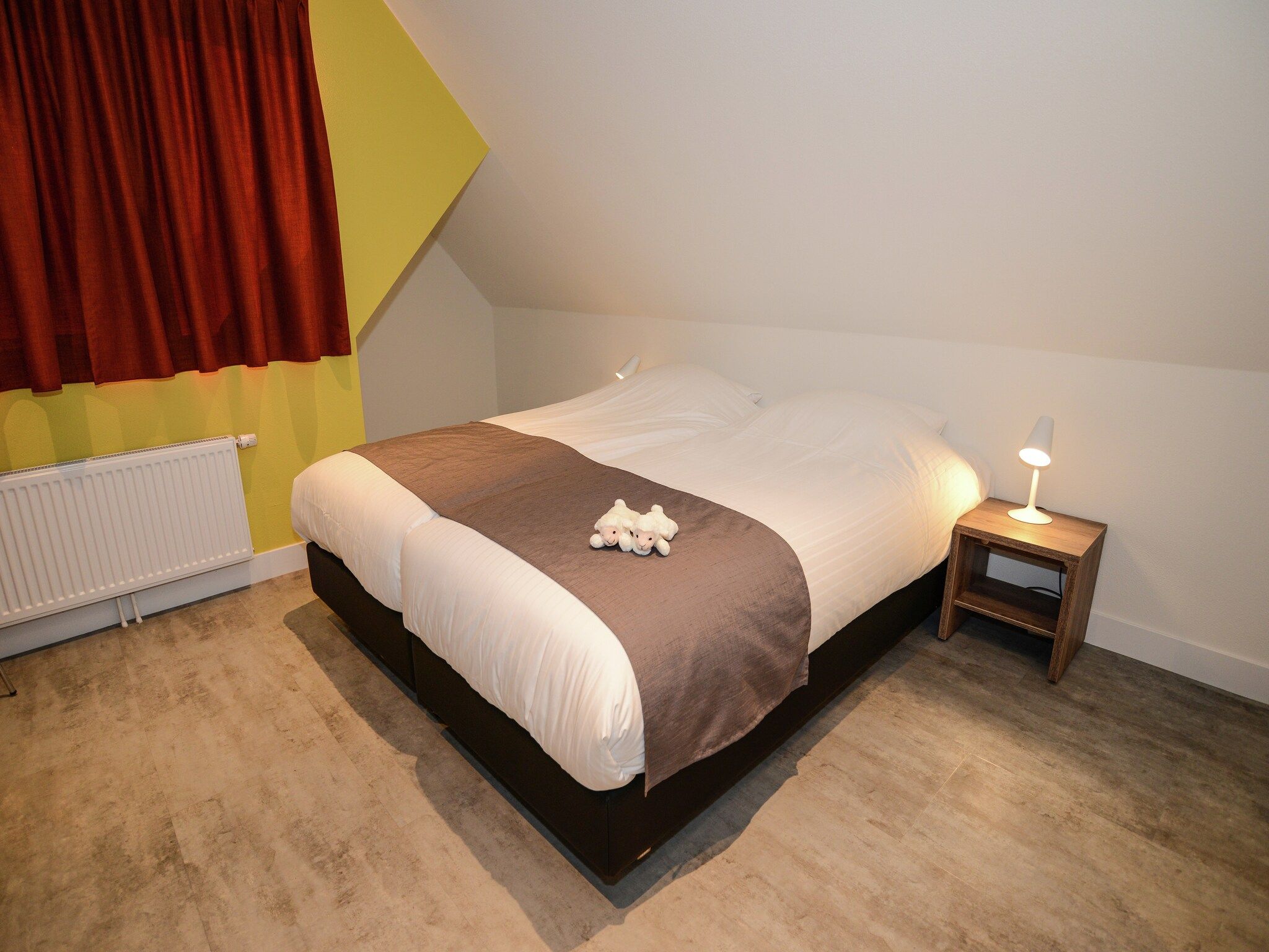 Een slaapkamer van Villa  Hoogelandt 10 in De Koog Texel