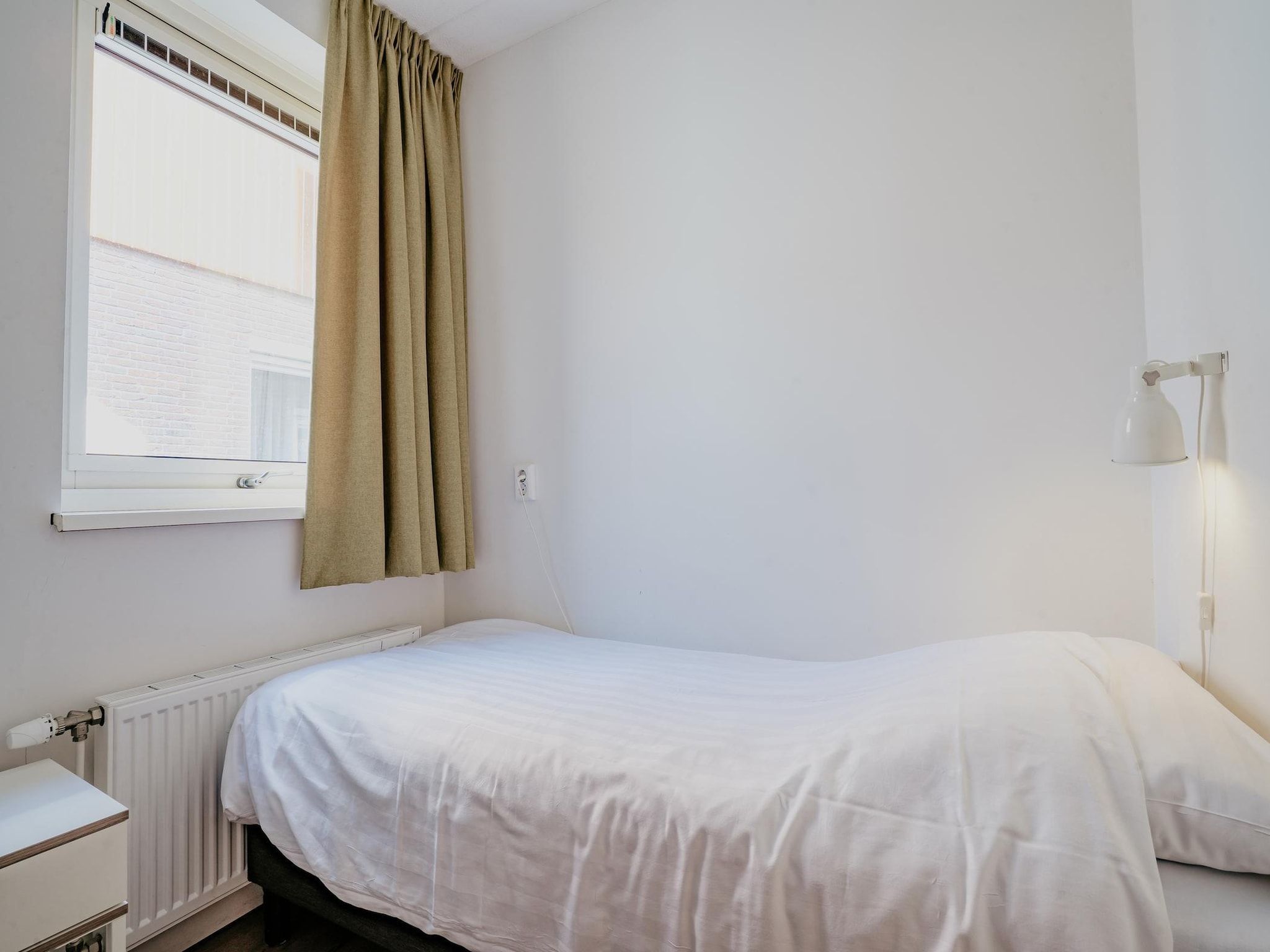 Een slaapkamer van Waterpark de Meerparel  1 in Uitgeest