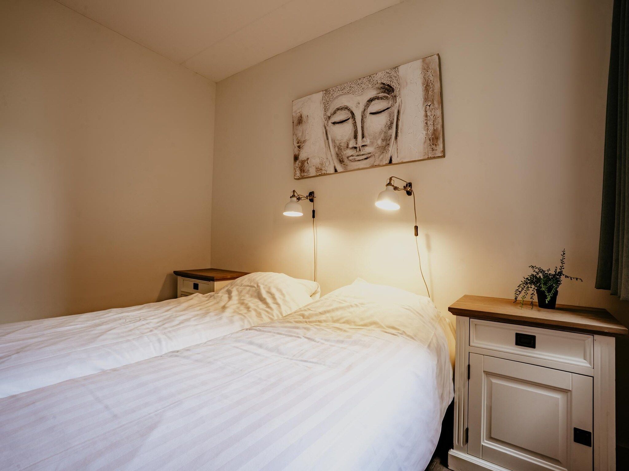 Een slaapkamer van Waterpark de Meerparel 8 in Uitgeest