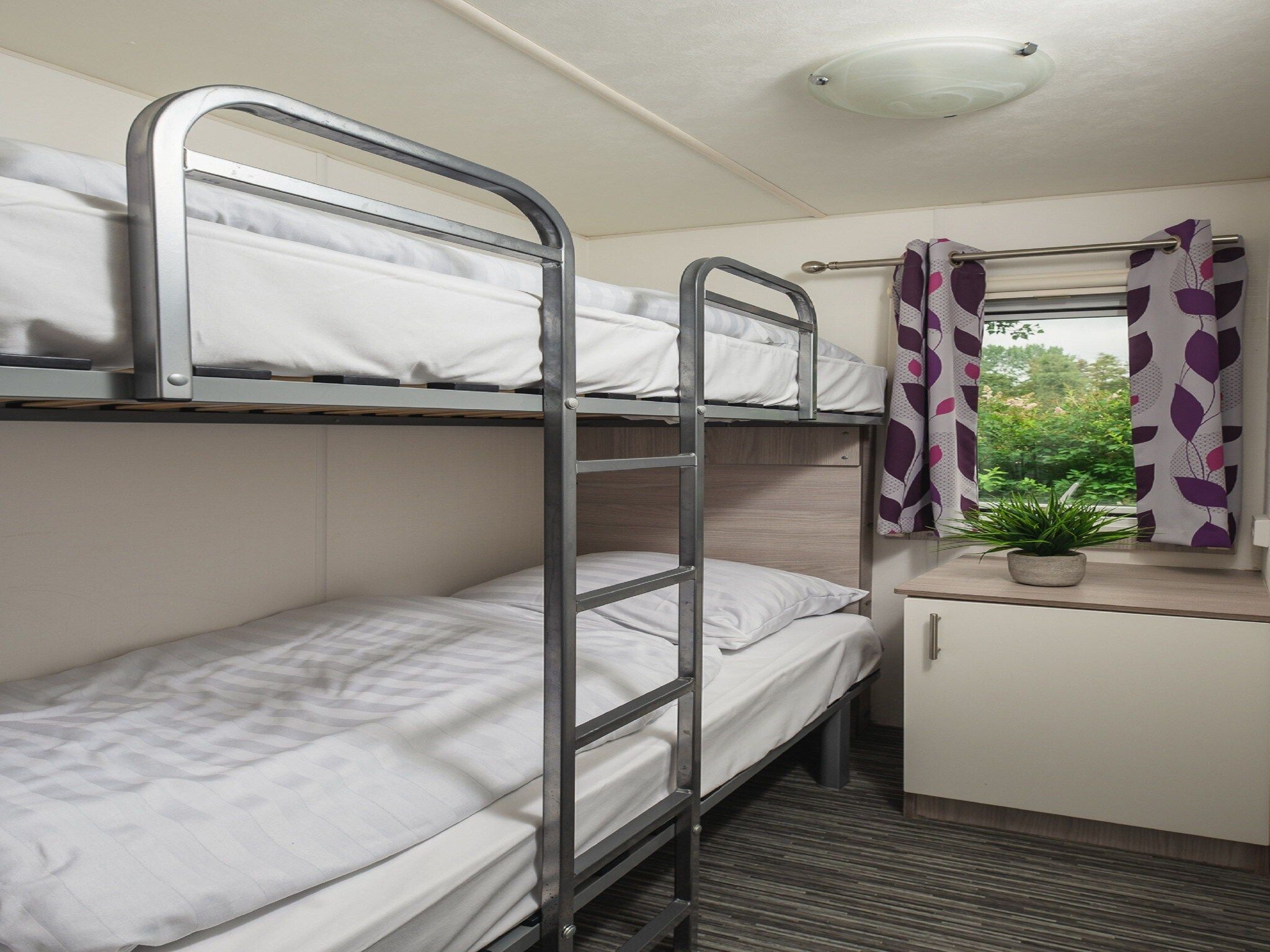 Een slaapkamer van Vakantiepark Mölke 5 in Zuna