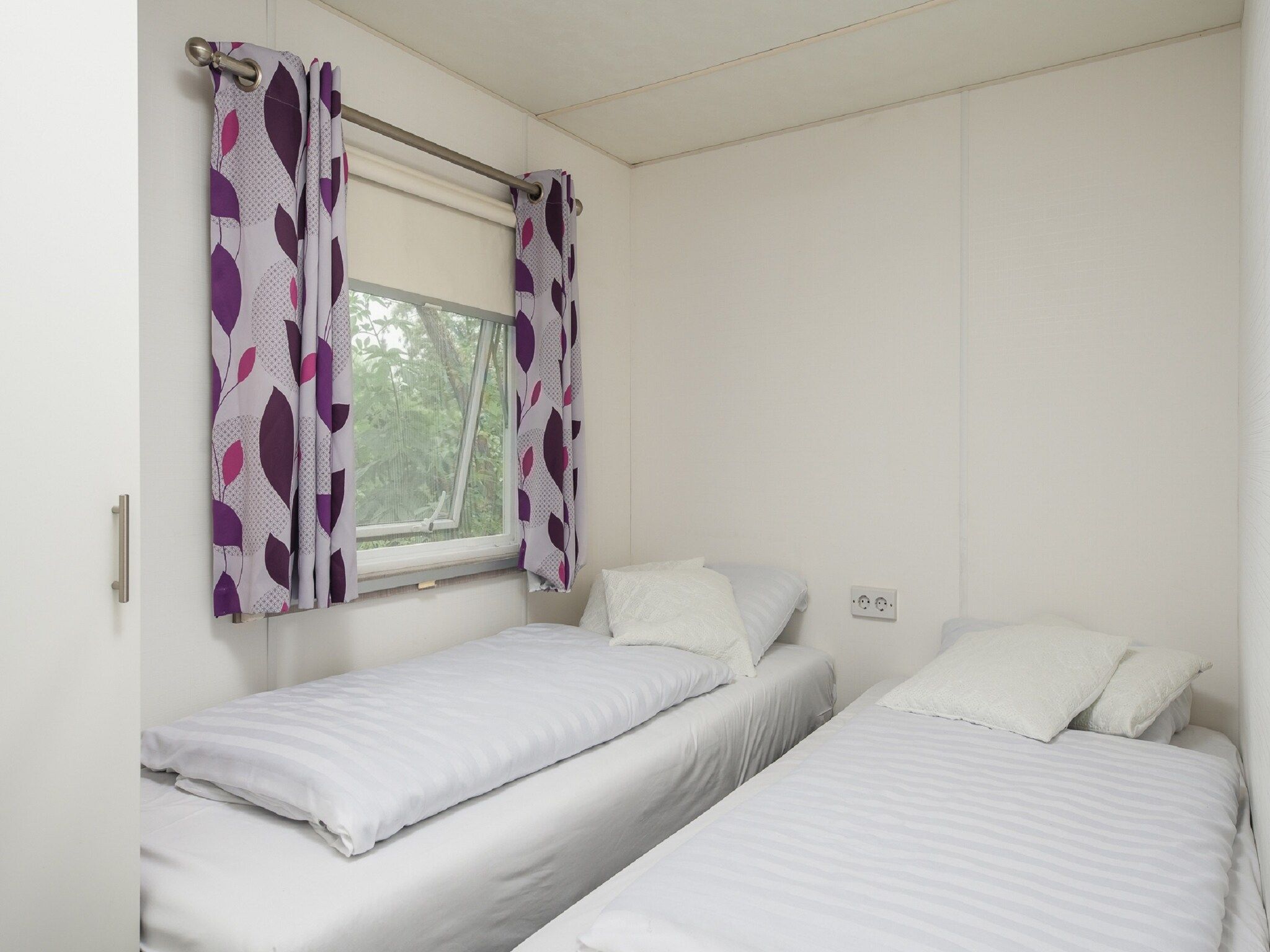 Een slaapkamer van Vakantiepark Mölke 5 in Zuna