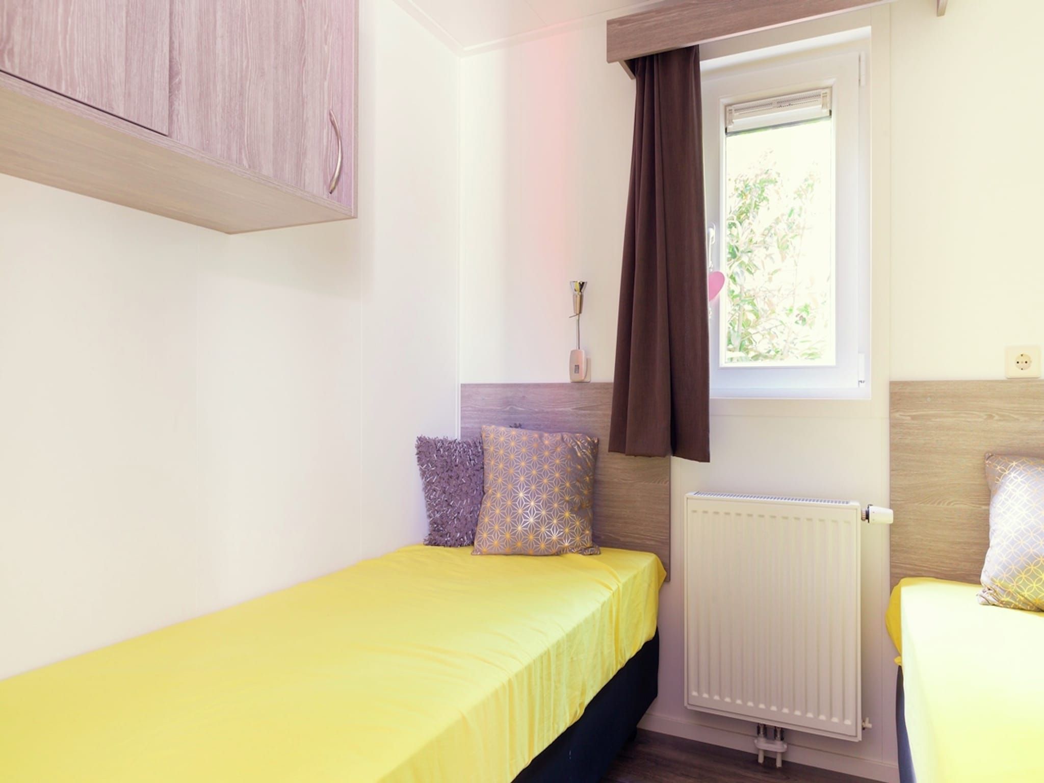 Een slaapkamer van Vakantiepark Mölke 11 in Zuna